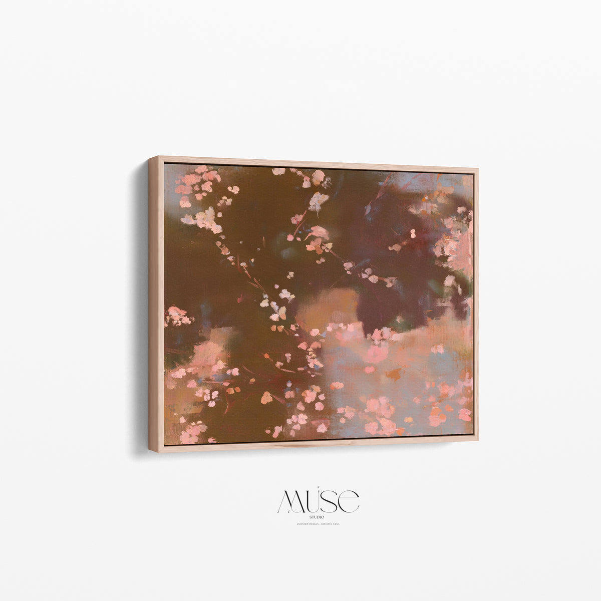 A framed abstract canvas print featuring a dark brown background with soft pink and peach floral-like brushstrokes, shown hanging on a light gray wall. The frame is a light wood tone, and a watermark reading MuSE appears below the artwork.