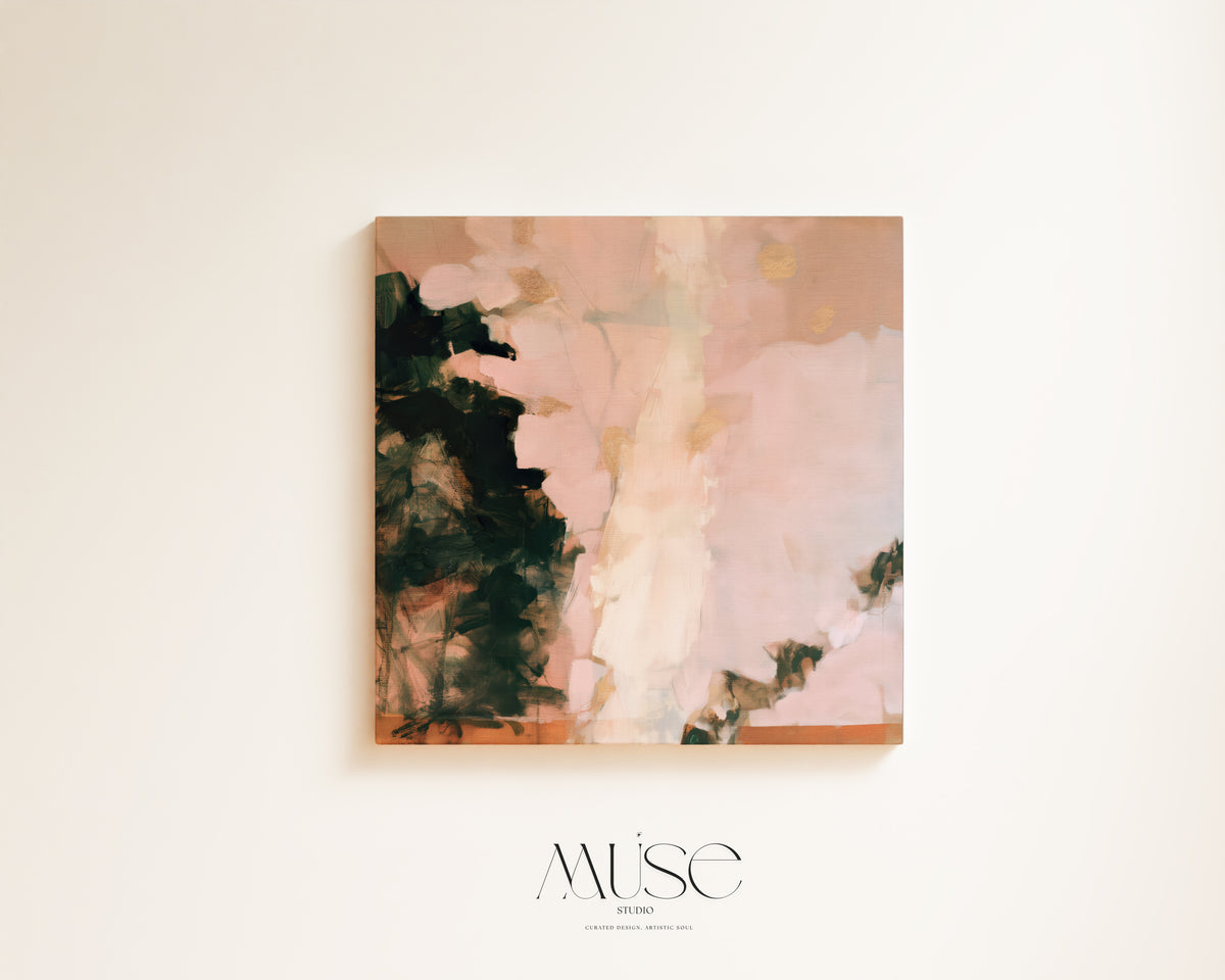 An abstract square canvas print featuring soft blush pink, cream, and dark charcoal-green brushstrokes, displayed on a warm off-white wall with a 'MüsE DESIGN' logo below.