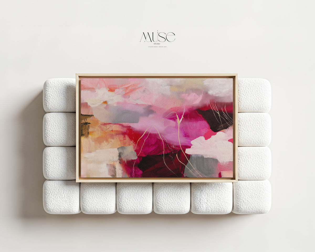 Autumn Abstract Canvas Above a Textured Bouclé Sofa — Autumn Blush No. 514a displayed in a light wood frame against a sculptural white bouclé sofa.