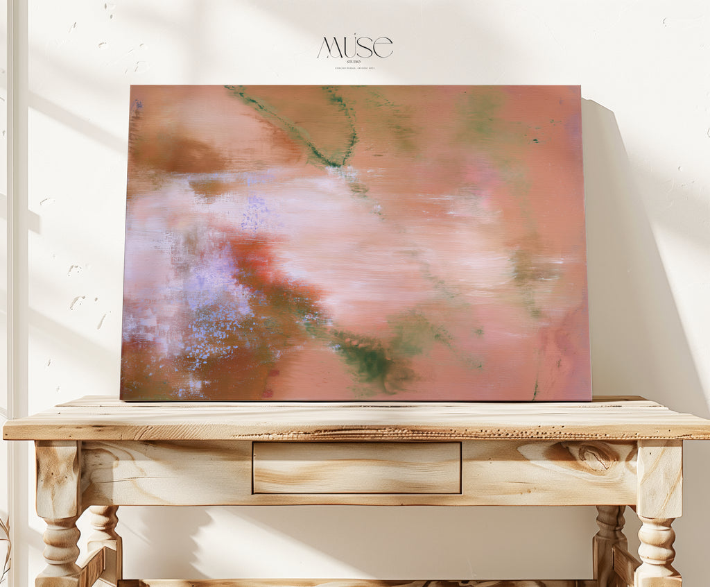 Amber Petal organic abstract canvas wall art in warm autumnal tones resting on a carved wooden console table in a sunlit interior room.