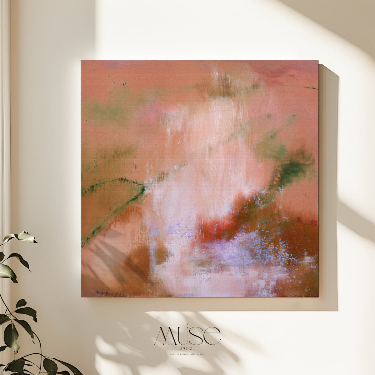 Square terracotta and peach abstract stretched canvas hanging on a warm beige plaster wall with soft botanical leaf shadows and houseplant foliage in the foreground.