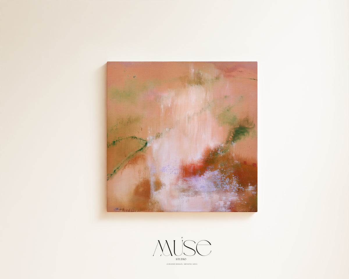 An abstract canvas painting with soft peach, pink, cream, and rust tones, hanging on a light beige wall. The word 'MüsE' appears below the artwork in a thin serif font.