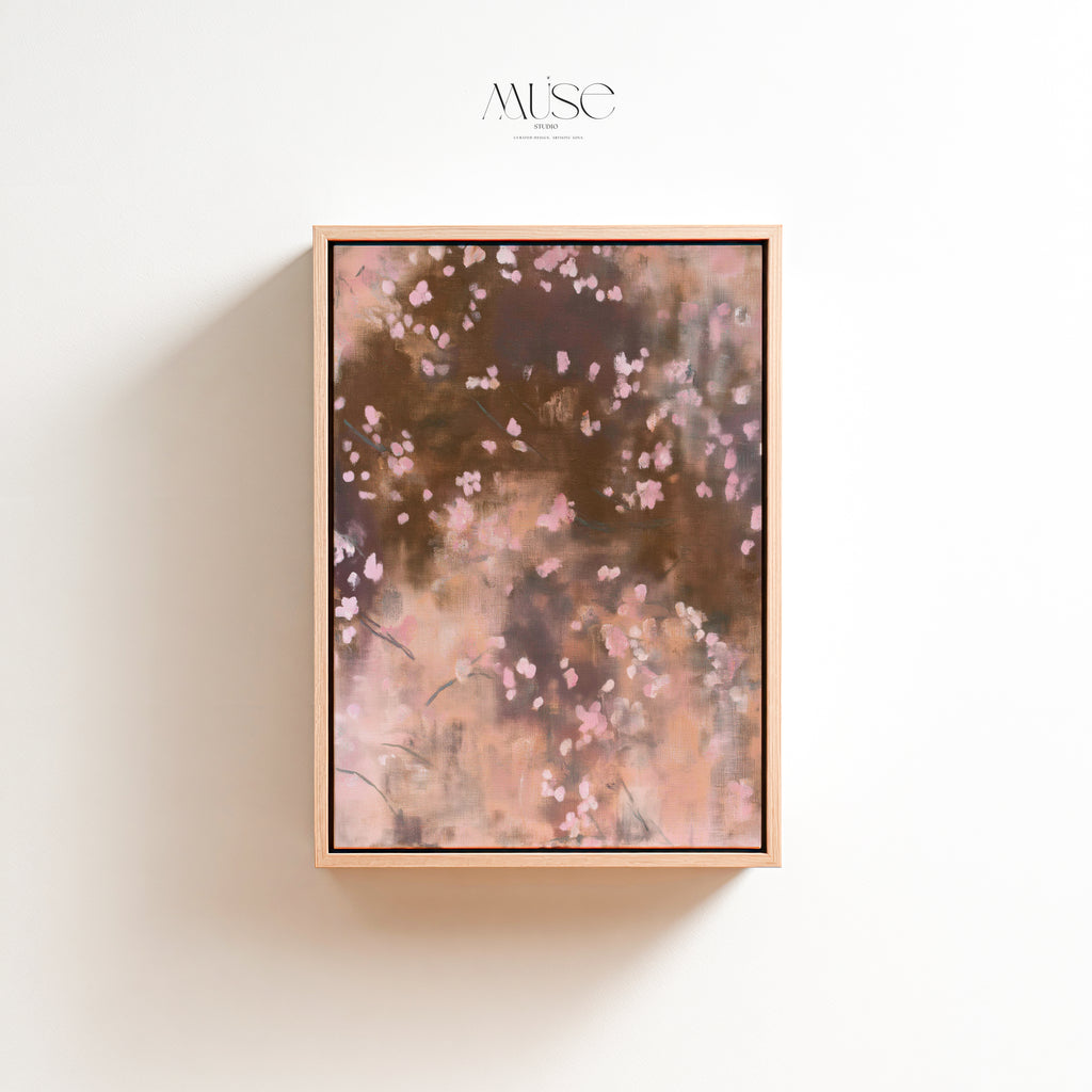 Studio product mockup of Dawn Nocturne No. 1123 vertical framed canvas featuring soft pink abstract blossoms and rich cocoa tones in a modern natural wood floater frame.