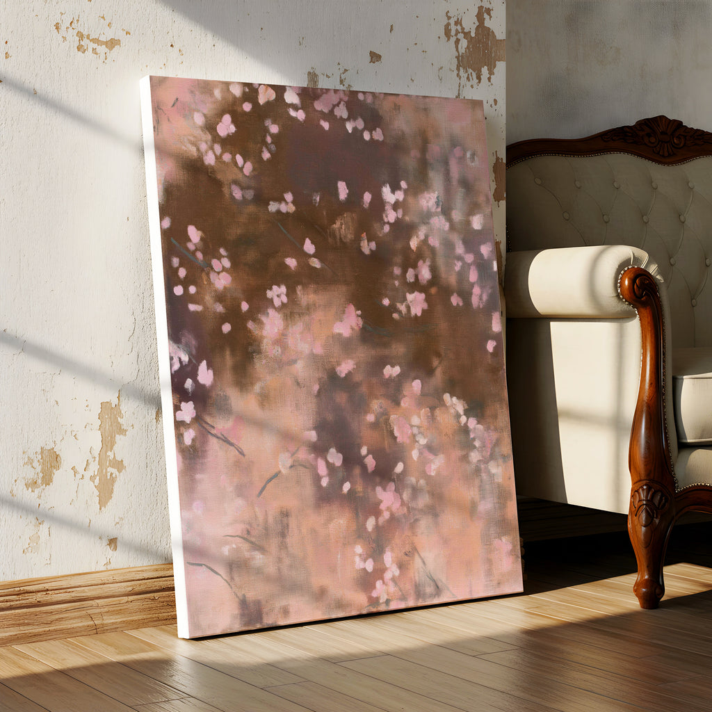 A close-up view of the Dawn Nocturne No. 1123 gallery-wrapped canvas leaning on a worn, textured plaster wall next to the arm of an antique, ornate settee on a wood floor.