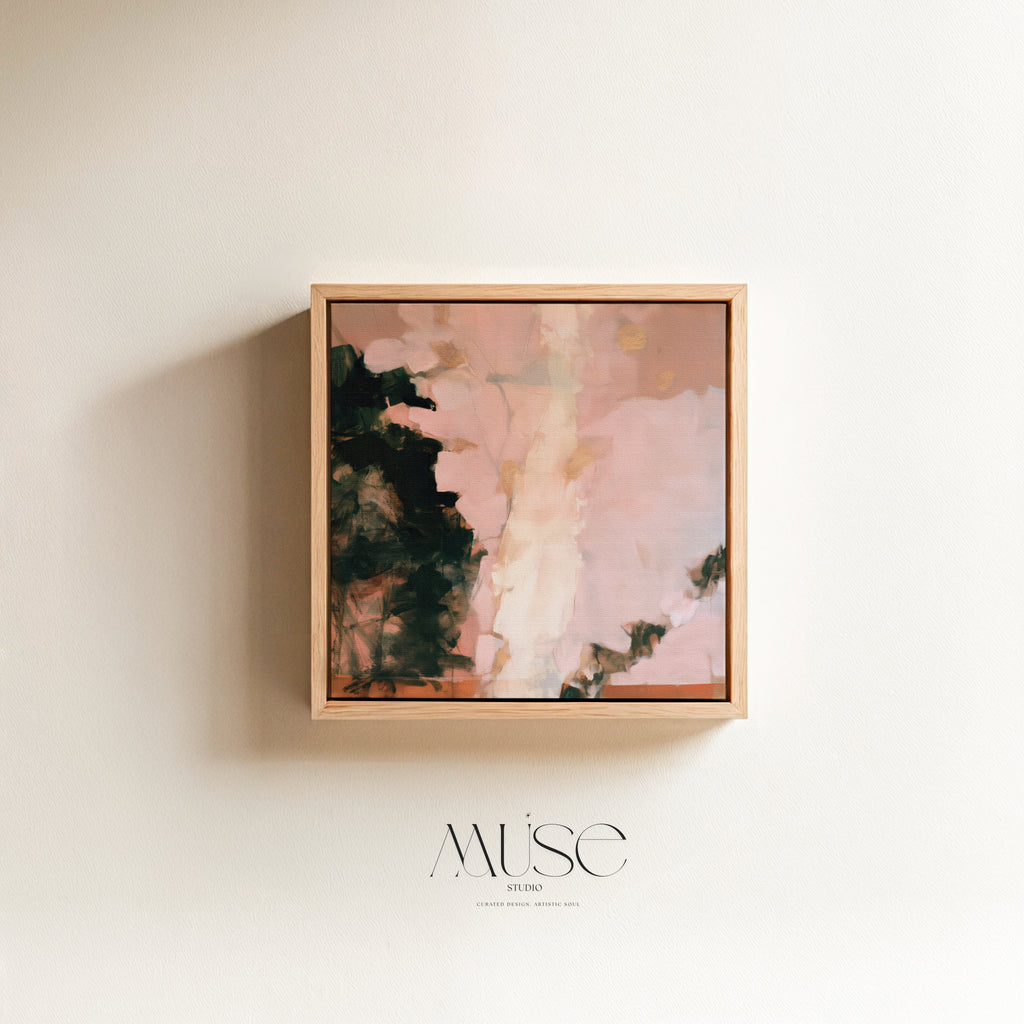 Square abstract oil painting print in blush pink, deep charcoal green, and gold accent tones encased in a thin natural wood floater frame casting a soft side shadow on a neutral wall.