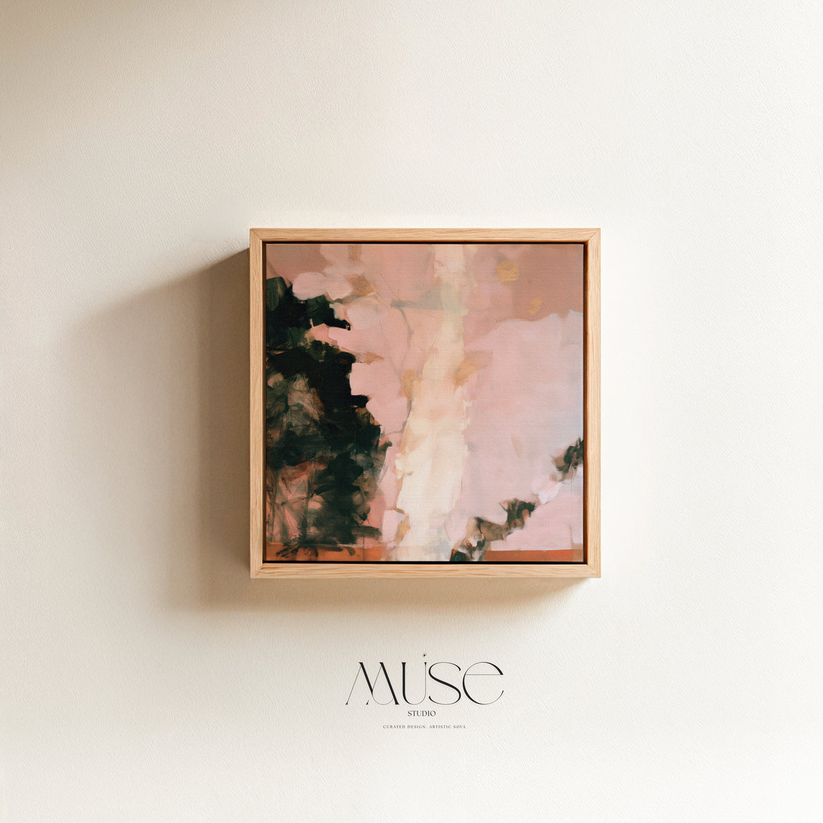 Square abstract oil painting print in blush pink, deep charcoal green, and gold accent tones encased in a thin natural wood floater frame casting a soft side shadow on a neutral wall.