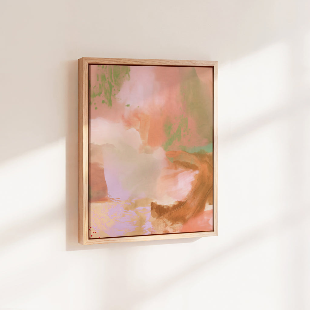 Angled side-perspective view of the framed vertical abstract canvas print mounted on a warm off-white studio wall illuminated by soft diagonal window light and shadows.