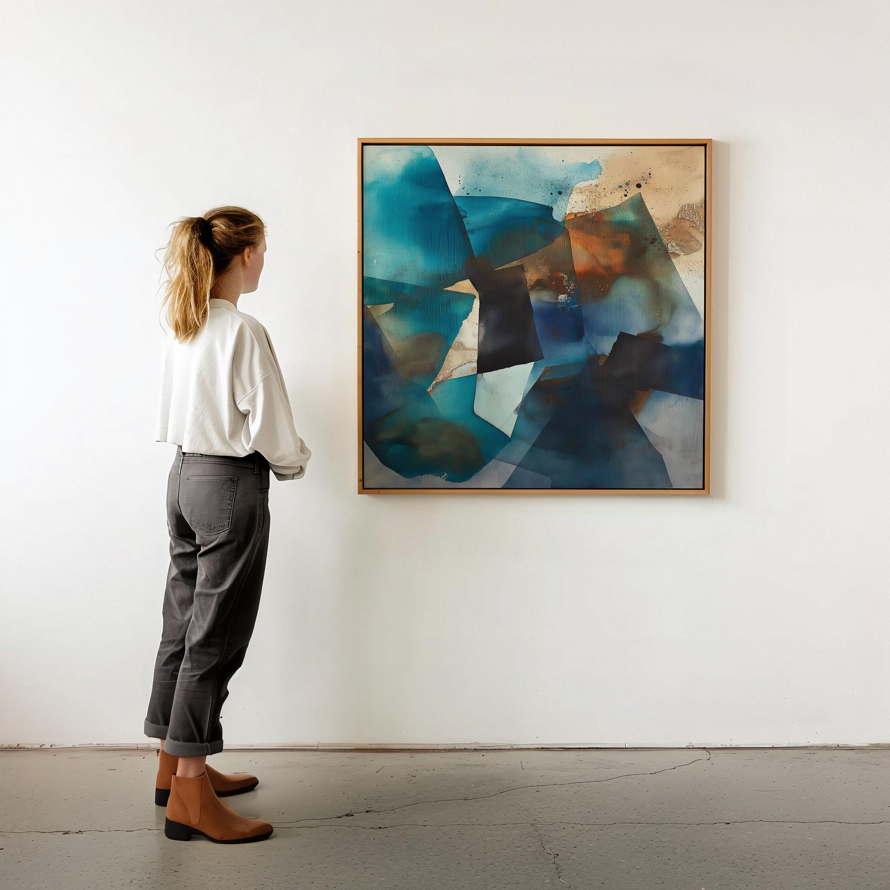 Square abstract wall art featuring deep teal, black, and rust tones leaning against a textured sunlit wall. Earthy modern framed canvas artwork with bold geometric movement, ideal for living room or designer interiors. Available as framed wall art or giclée canvas by Muse Studio.