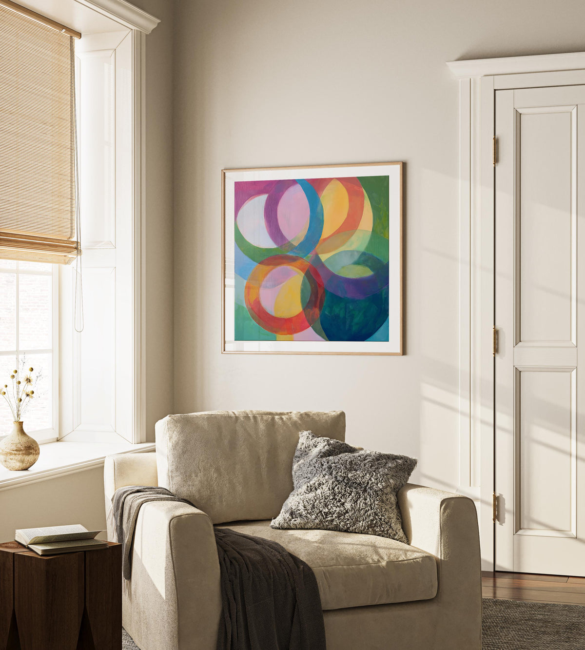 Large square abstract wall art featuring bold pink and orange geometric circles in a retro-inspired composition, printed as large canvas wall art and styled in a modern home office to create a vibrant mid-century statement focal point.