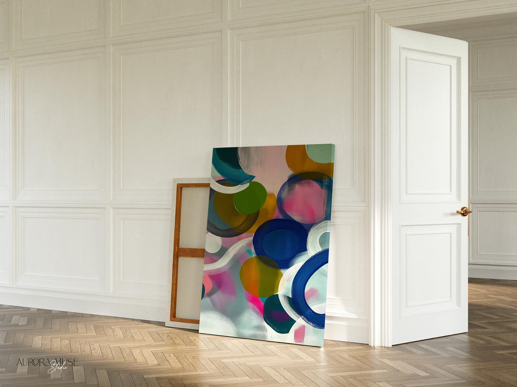 Large square abstract wall art featuring bright pink, blue, and green tones in a bold color pop composition, printed as large canvas wall art and styled in a modern living room to create an energetic statement focal point.