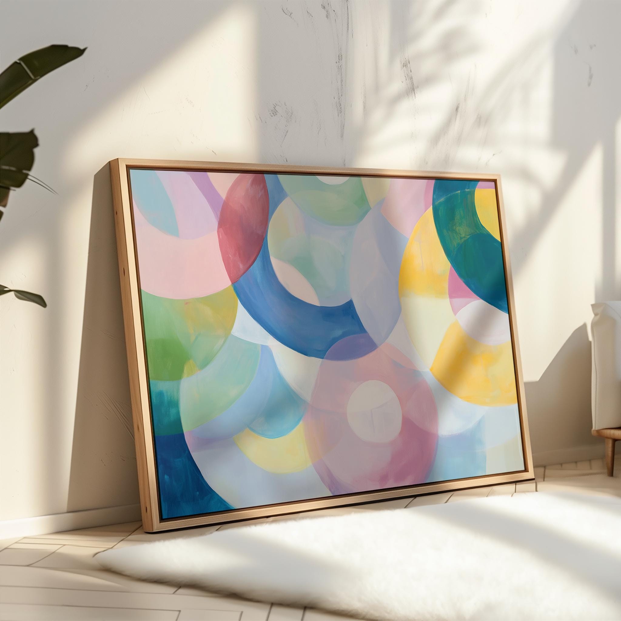 Kaleidoscope No. 401 by Muse Studio & Co. pastel abstract wall art print with soft pink, blue, and multicolor circles, printed with museum-grade giclée inks on premium artist paper, styled as playful colorful decor in a kids room or nursery.