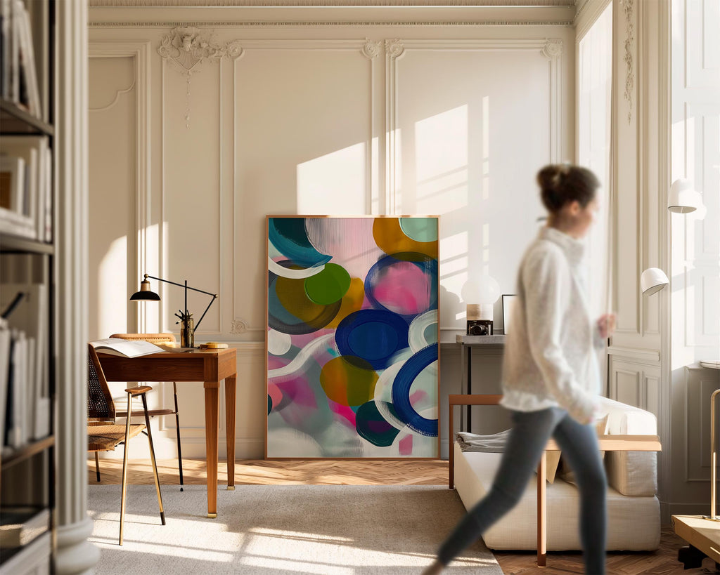 Large square abstract wall art featuring bright pink, blue, and green tones in a bold color pop composition, printed as large canvas wall art and styled in a modern living room to create an energetic statement focal point.