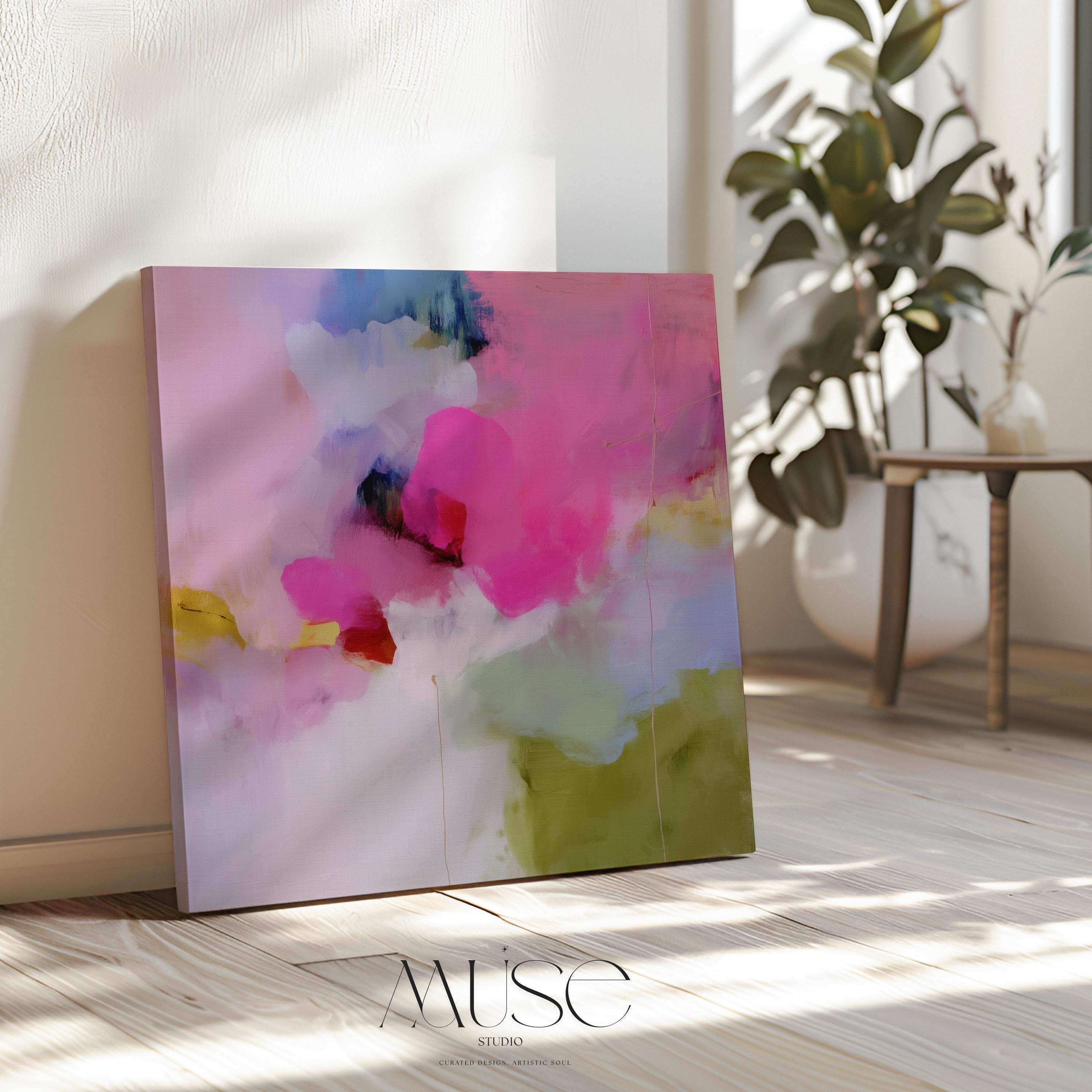 Square abstract canvas wall art featuring a vivid blend of hot pink, olive green, lilac, and blush tones. Painted in a soft coquette style, this artwork brings a playful yet refined energy to modern bedrooms, nursery spaces, or colorful living rooms. Printed on 400gsm cotton canvas using archival giclée inks, available as a gallery-wrapped canvas or with a custom float frame. Muse Studio decor art for curated, color-forward spaces.