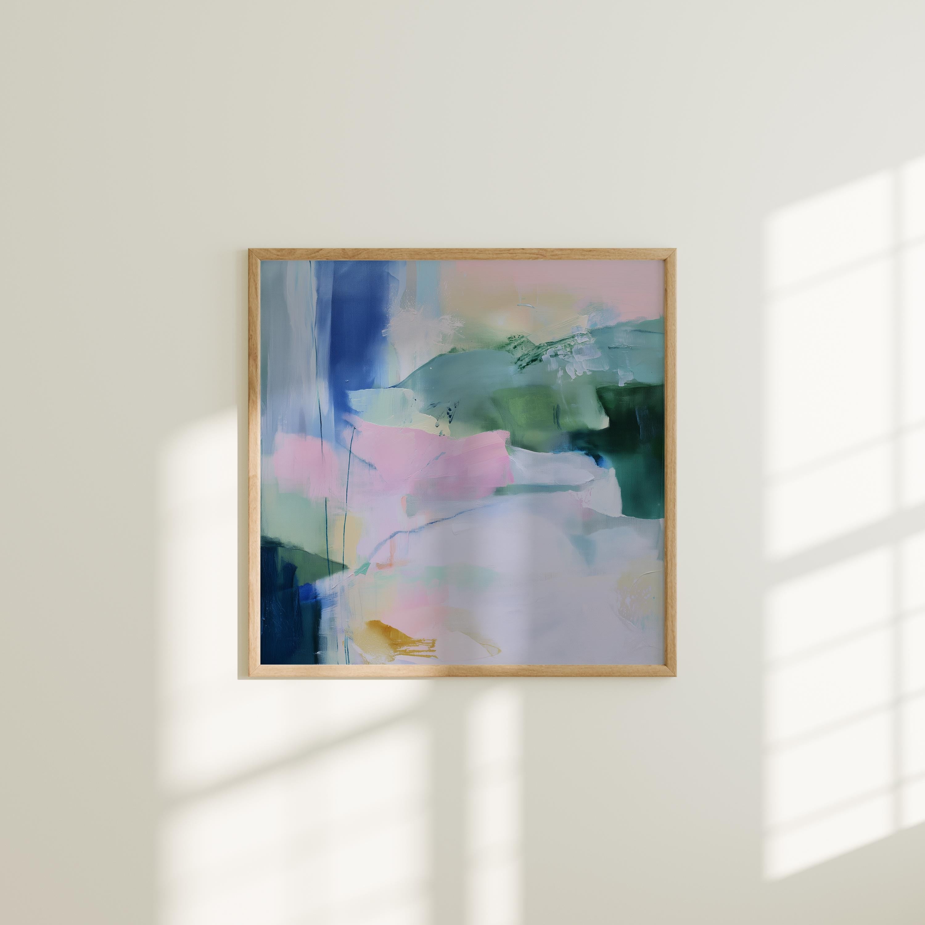 Square pastel abstract wall art in soft green, blue, and pink hues with a minimalist, serene design. Ideal for bedrooms or nurseries seeking gentle color and calm ambiance. Available as fine art poster or framed wall art by Muse Studio.