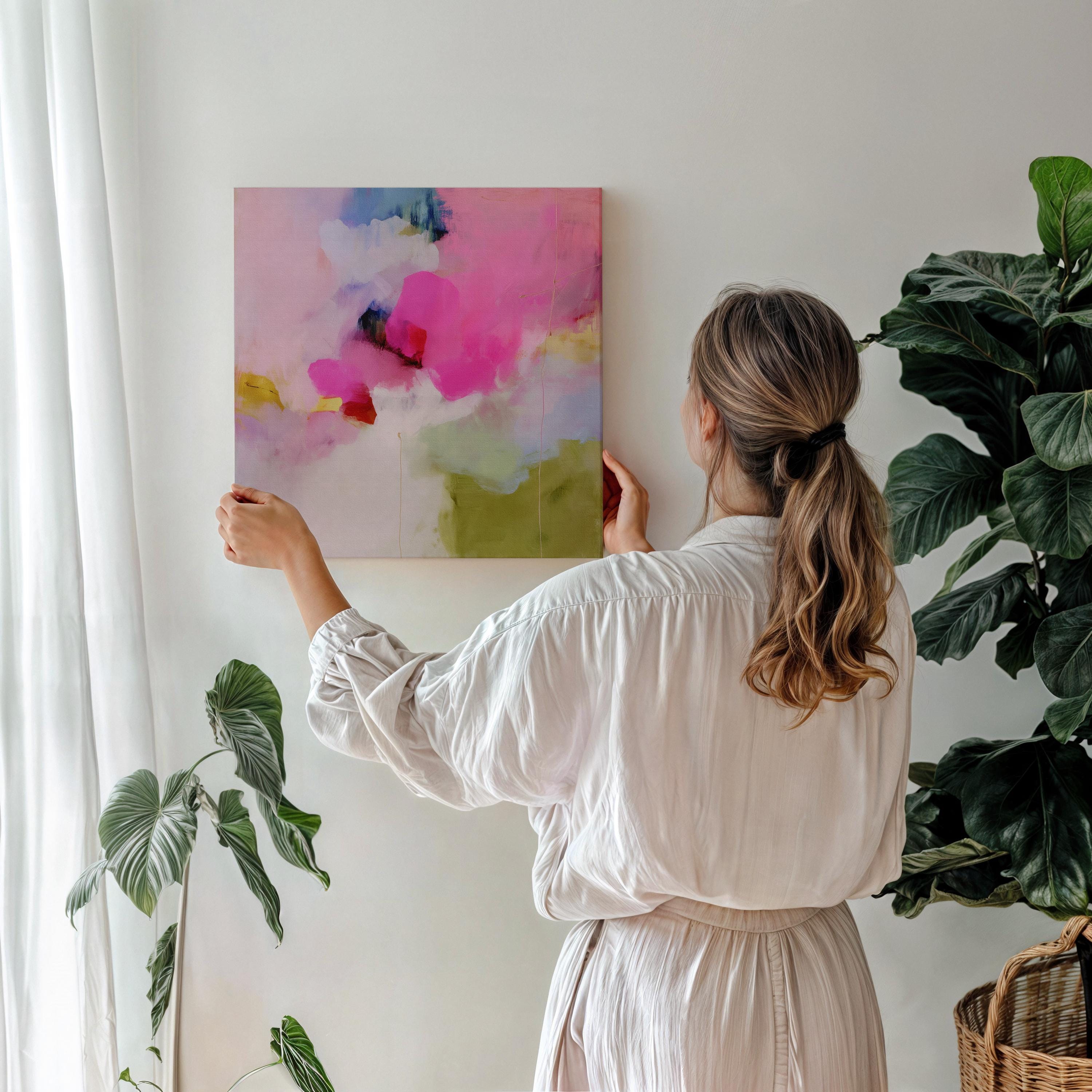 Square abstract canvas wall art featuring a vivid blend of hot pink, olive green, lilac, and blush tones. Painted in a soft coquette style, this artwork brings a playful yet refined energy to modern bedrooms, nursery spaces, or colorful living rooms. Printed on 400gsm cotton canvas using archival giclée inks, available as a gallery-wrapped canvas or with a custom float frame. Muse Studio decor art for curated, color-forward spaces.