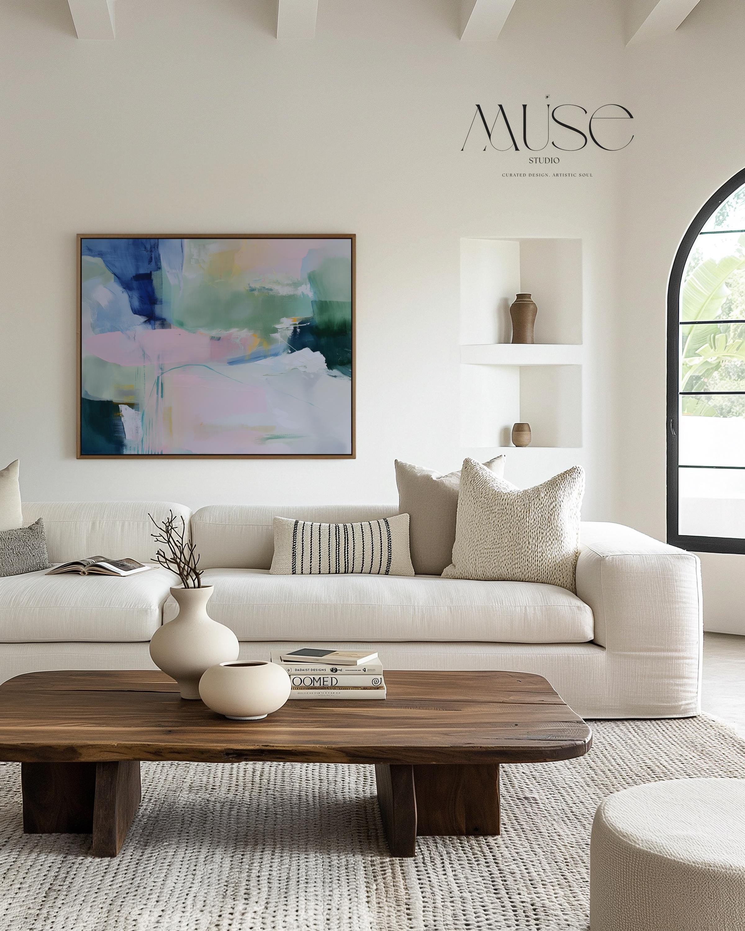 Drifting Dreams No. 422 by Muse Studio & Co. colorful abstract wall art in blue, green, and blush pink, large horizontal canvas printed with museum-grade giclée inks on premium gallery-wrapped canvas. Staged in modern neutral decor as a statement piece for living room, bedroom, or office interiors.