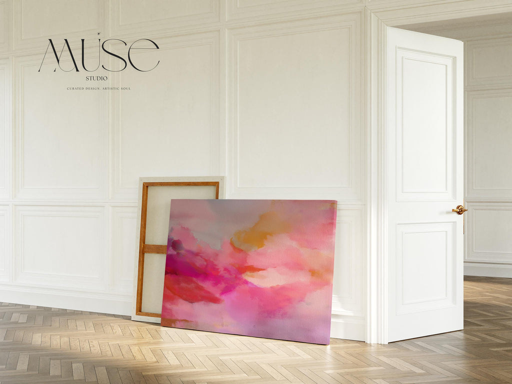 Large horizontal stretched canvas wall art in soft pink, golden orange, and warm blush tones. Features an abstract pastel cloudscape with painterly textures. Ideal for dreamy bedrooms, cozy studios, or soft contemporary interiors. Offered as gallery-wrapped canvas or with optional wood floating frame. From the Pink & Blush Wall Art collection by Muse Studio. Available in multiple large-format sizes for statement decor.