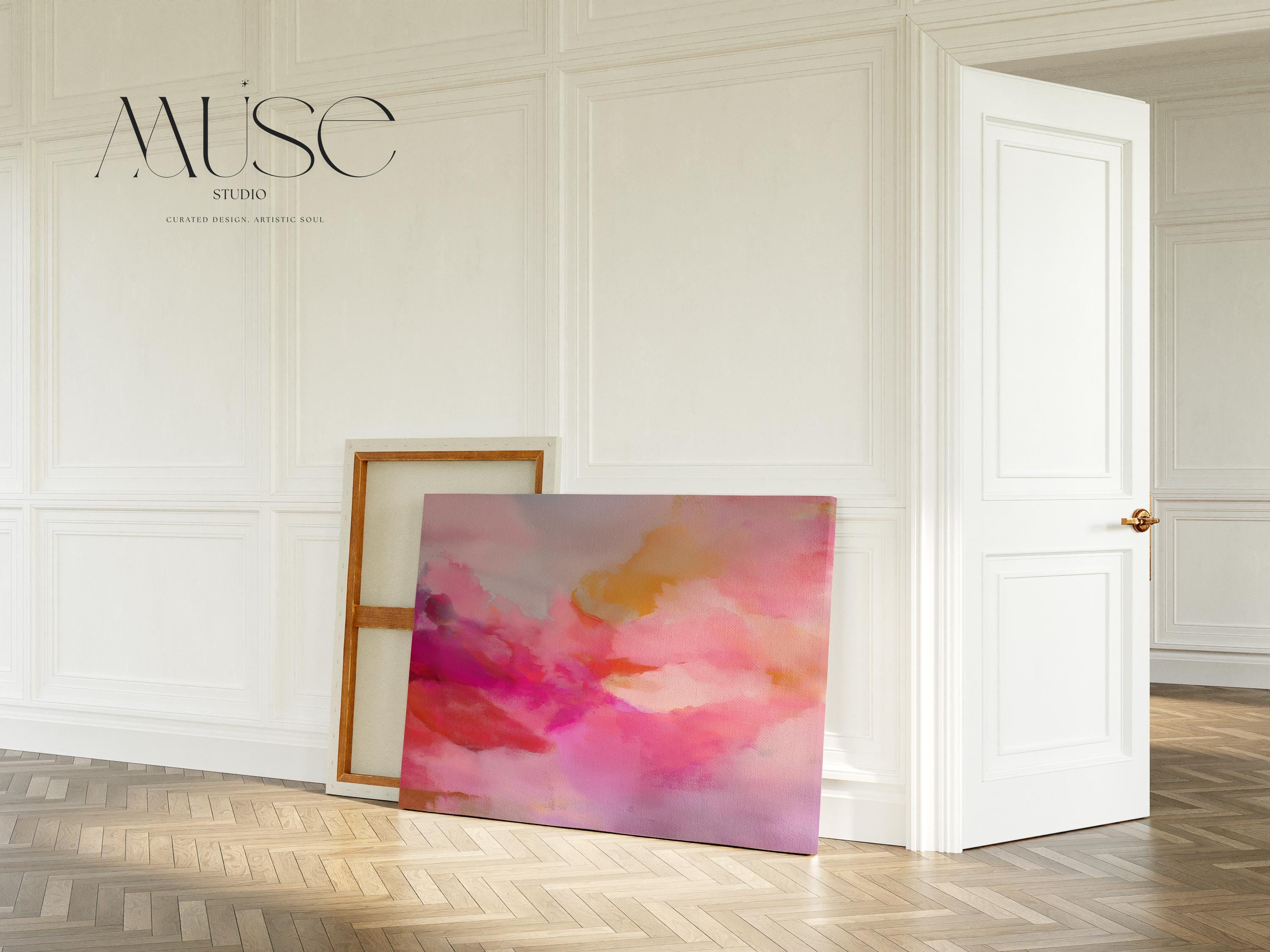 Large horizontal stretched canvas wall art in soft pink, golden orange, and warm blush tones. Features an abstract pastel cloudscape with painterly textures. Ideal for dreamy bedrooms, cozy studios, or soft contemporary interiors. Offered as gallery-wrapped canvas or with optional wood floating frame. From the Pink & Blush Wall Art collection by Muse Studio. Available in multiple large-format sizes for statement decor.