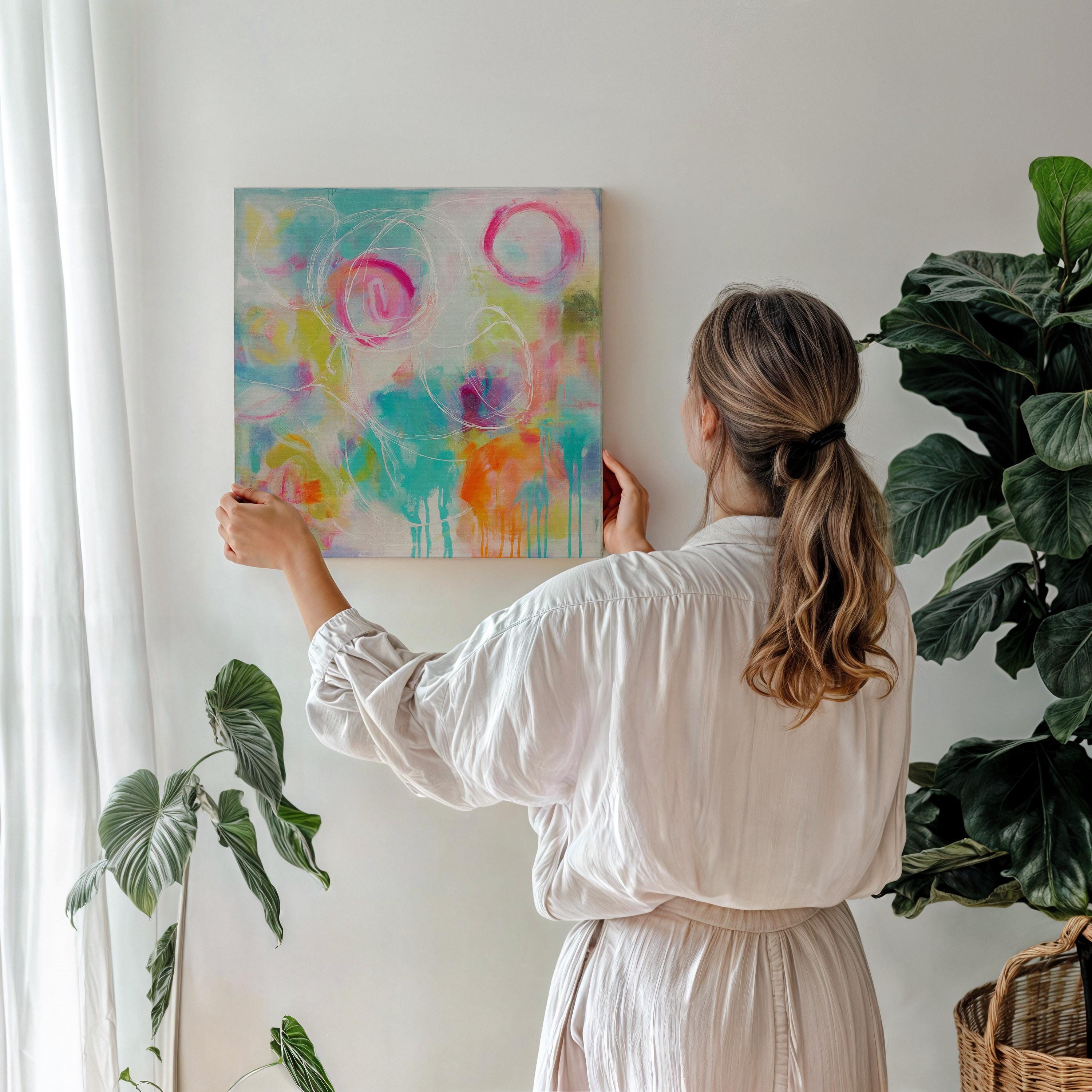 Colorful abstract canvas artwork with expressive pink, teal, and citrus brushstrokes, accented by white hand-drawn circular lines. The composition features bold drip techniques and a painterly blend of soft and vivid hues, creating a vibrant, uplifting mood ideal for designer living rooms, entryways, or creative spaces. Styled for high-end modern decor with a playful twist.