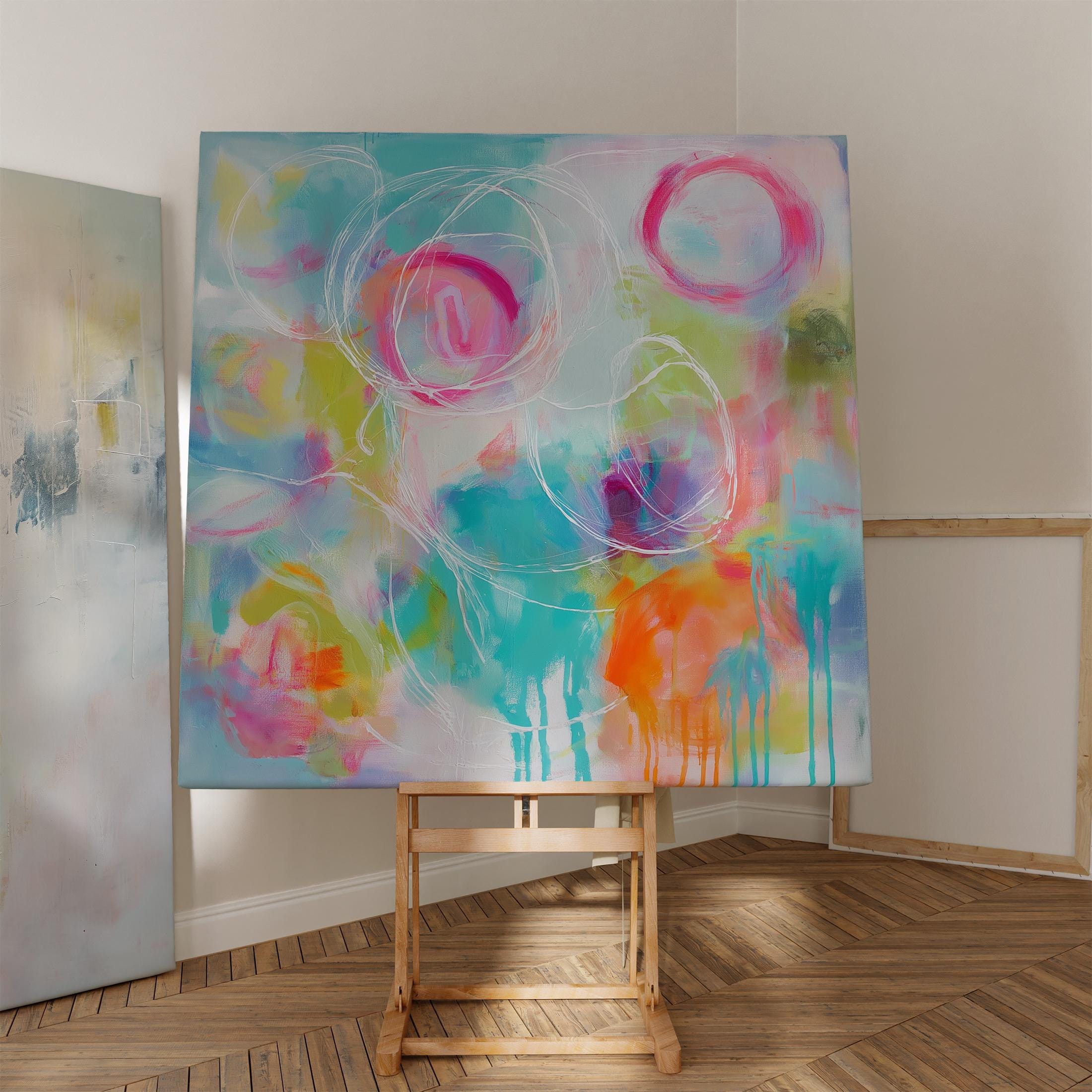 Colorful abstract canvas artwork with expressive pink, teal, and citrus brushstrokes, accented by white hand-drawn circular lines. The composition features bold drip techniques and a painterly blend of soft and vivid hues, creating a vibrant, uplifting mood ideal for designer living rooms, entryways, or creative spaces. Styled for high-end modern decor with a playful twist.