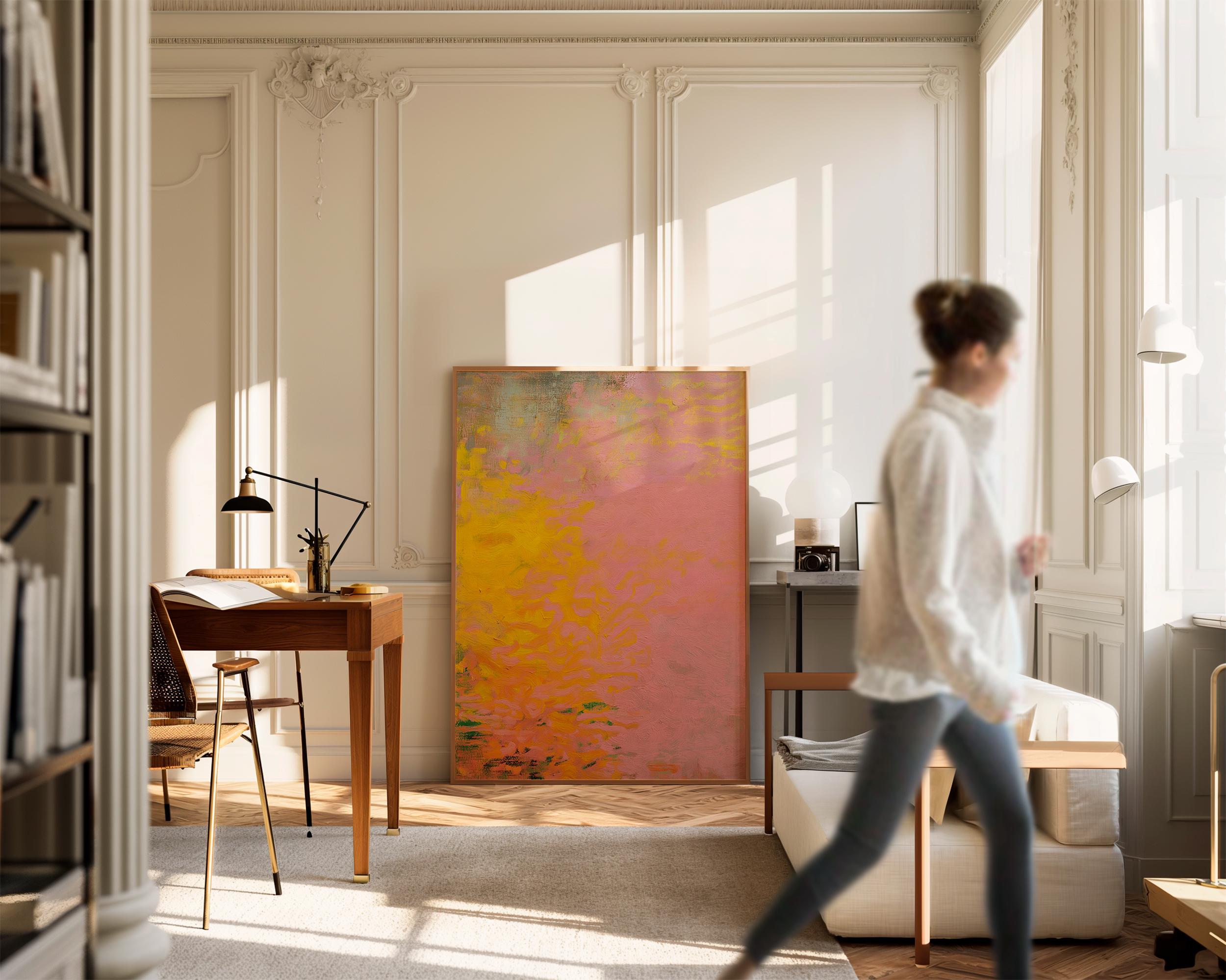 Vertical framed canvas wall art featuring a bold abstract blend of pink, orange, and yellow tones. The textured gradient evokes sunset warmth and modern earthiness, styled here in a neutral living room with wood furniture, clean lines, and soft minimal accents. Ideal for entryways, minimalist interiors, or natural modern decor spaces seeking a colorful yet refined focal piece.