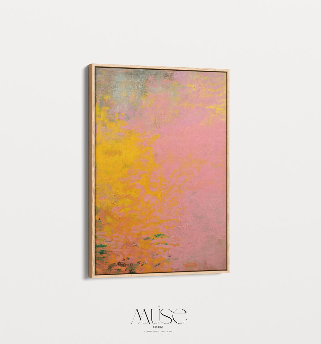 Vertical framed canvas wall art featuring a bold abstract blend of pink, orange, and yellow tones. The textured gradient evokes sunset warmth and modern earthiness, styled here in a neutral living room with wood furniture, clean lines, and soft minimal accents. Ideal for entryways, minimalist interiors, or natural modern decor spaces seeking a colorful yet refined focal piece.