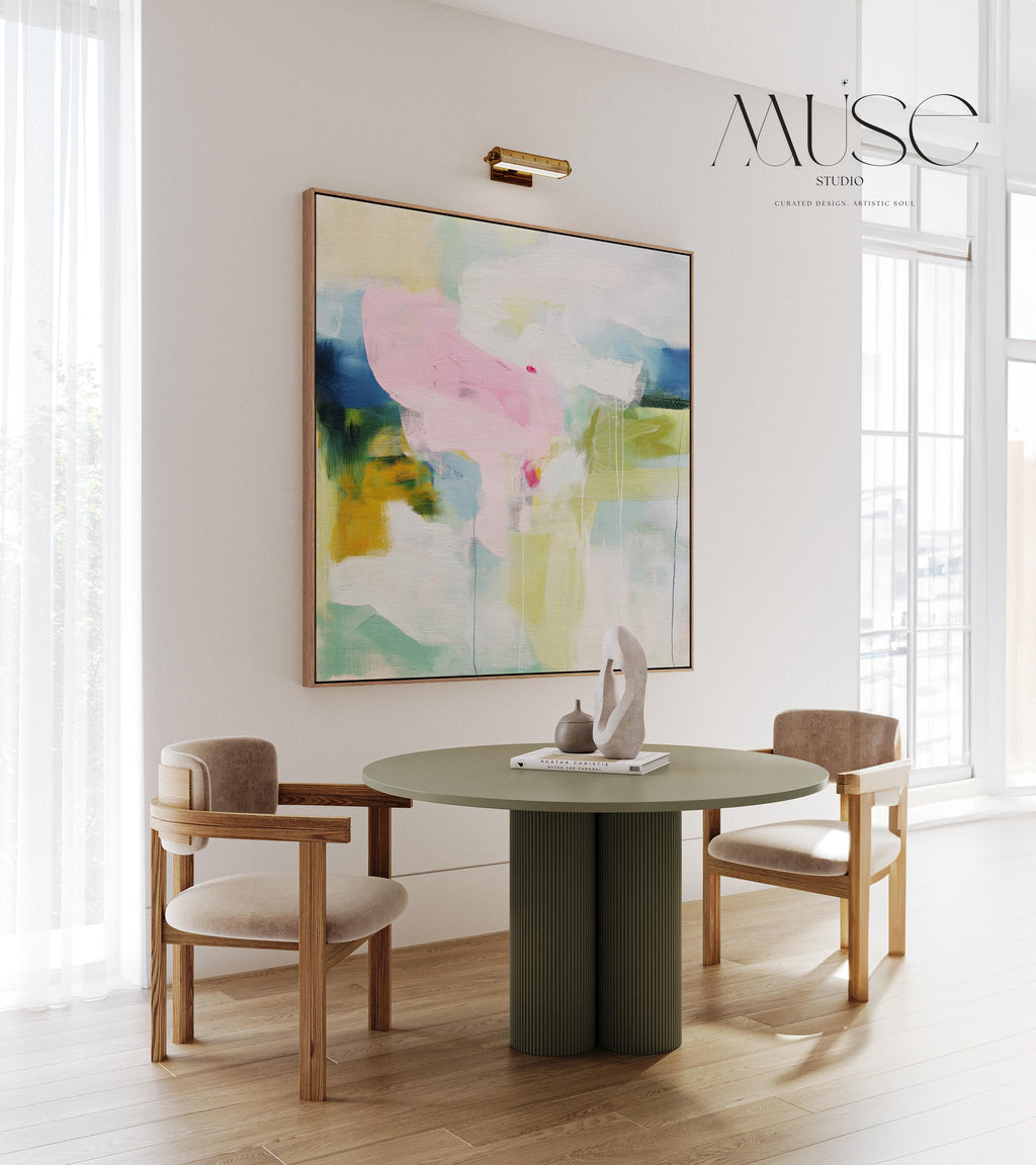 Muse Studio Aurora Muse 485 soft blue and blush abstract wall art printed with museum-grade giclée inks on premium gallery-wrapped artist canvas, featuring airy layered brushwork in powder blue, muted blush, and warm undertones. Large-scale modern soft contemporary artwork styled above a linen sofa in an organic transitional living room with light oak finishes, warm white walls, and brushed brass accents, creating a calm refined focal point for elevated interiors.