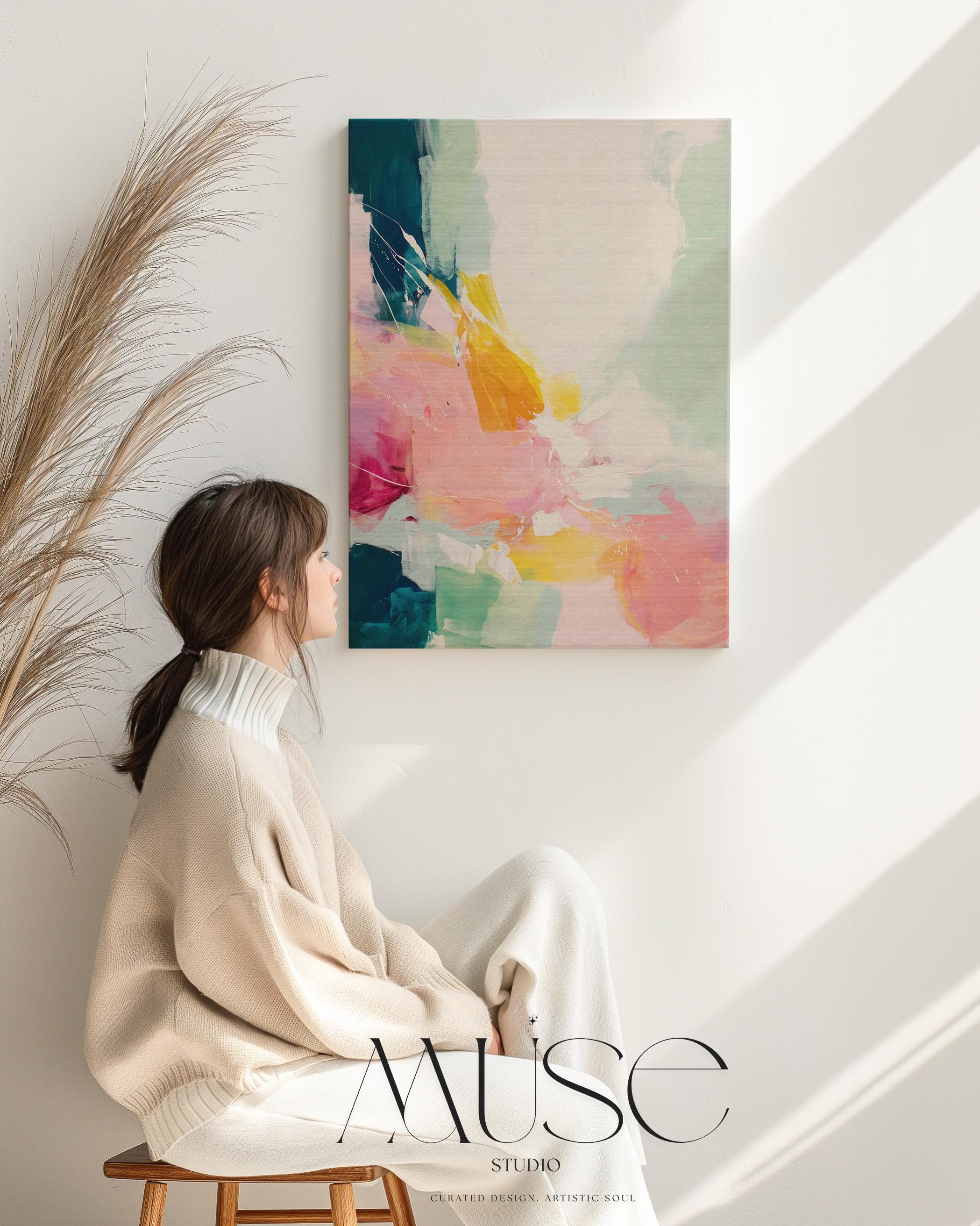 Vertical abstract wall art with soft contemporary styling, featuring bold strokes of pink, coral, teal, yellow, and soft mint green. The vibrant yet airy composition is printed on a high-quality canvas, displayed against a clean white wall in natural light. This color pop artwork from Muse Studio brings energetic movement and a modern touch to curated interiors, perfect for bedrooms, entryways, or stylish living spaces.