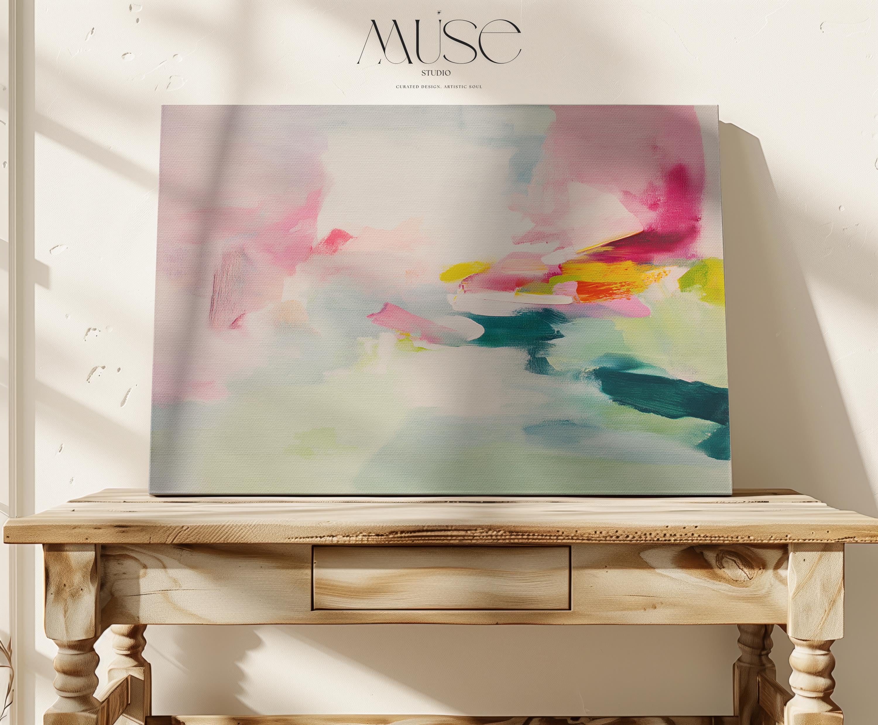 Large abstract canvas wall art with soft contemporary styling in blush pink, seafoam green, and vibrant accents of teal, yellow, and fuchsia. The airy brushwork evokes a dreamy horizon, perfect for serene yet colorful interiors. Shown unframed and mounted in a modern room with warm light and minimalist styling. Ideal for living rooms, bedrooms, or design-forward spaces. From Muse Studio – curated boutique decor art styled for life.