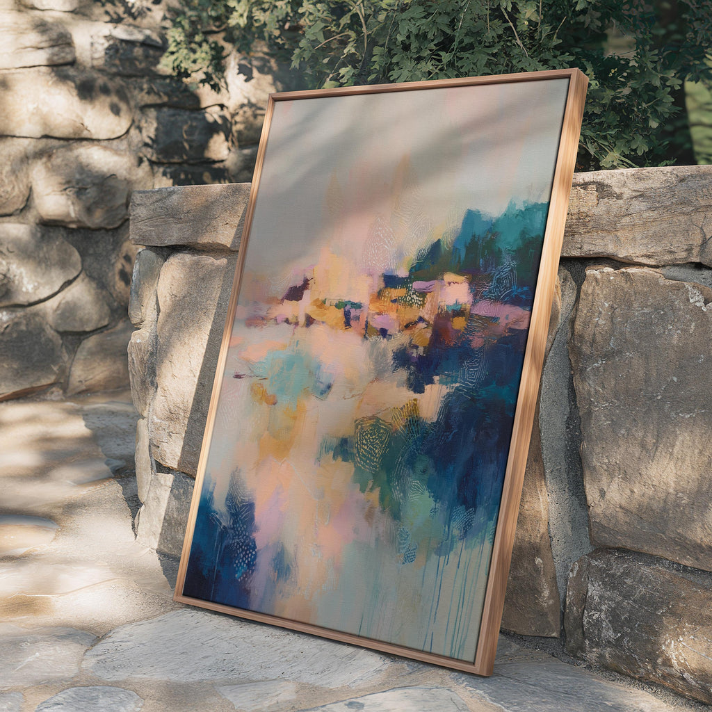Vertical framed abstract wall art in blush, peach, teal, and navy with soft painterly textures and subtle gold undertones. Ideal for bedrooms, transitional entryways, or softly styled interiors. Available as a floating framed canvas for curated, color-forward decor.