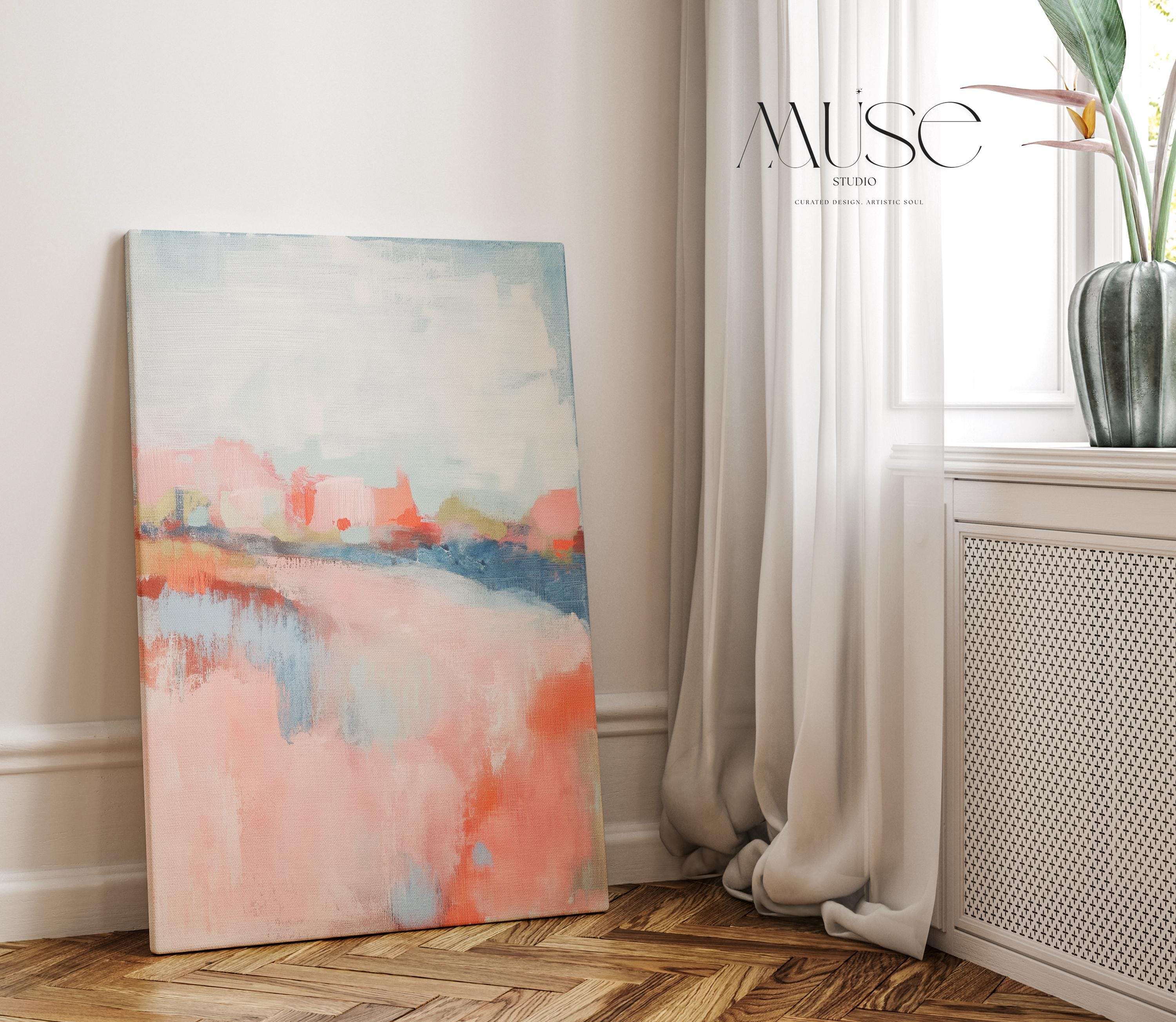 Abstract landscape canvas art featuring coral, soft blush, and blue tones in a peaceful painterly composition. Inspired by nature’s horizon, this vertical piece pairs beautifully with transitional, boho, or serene bedroom decor. Available as a fine art poster or canvas wall art for curated, color-forward decor.
