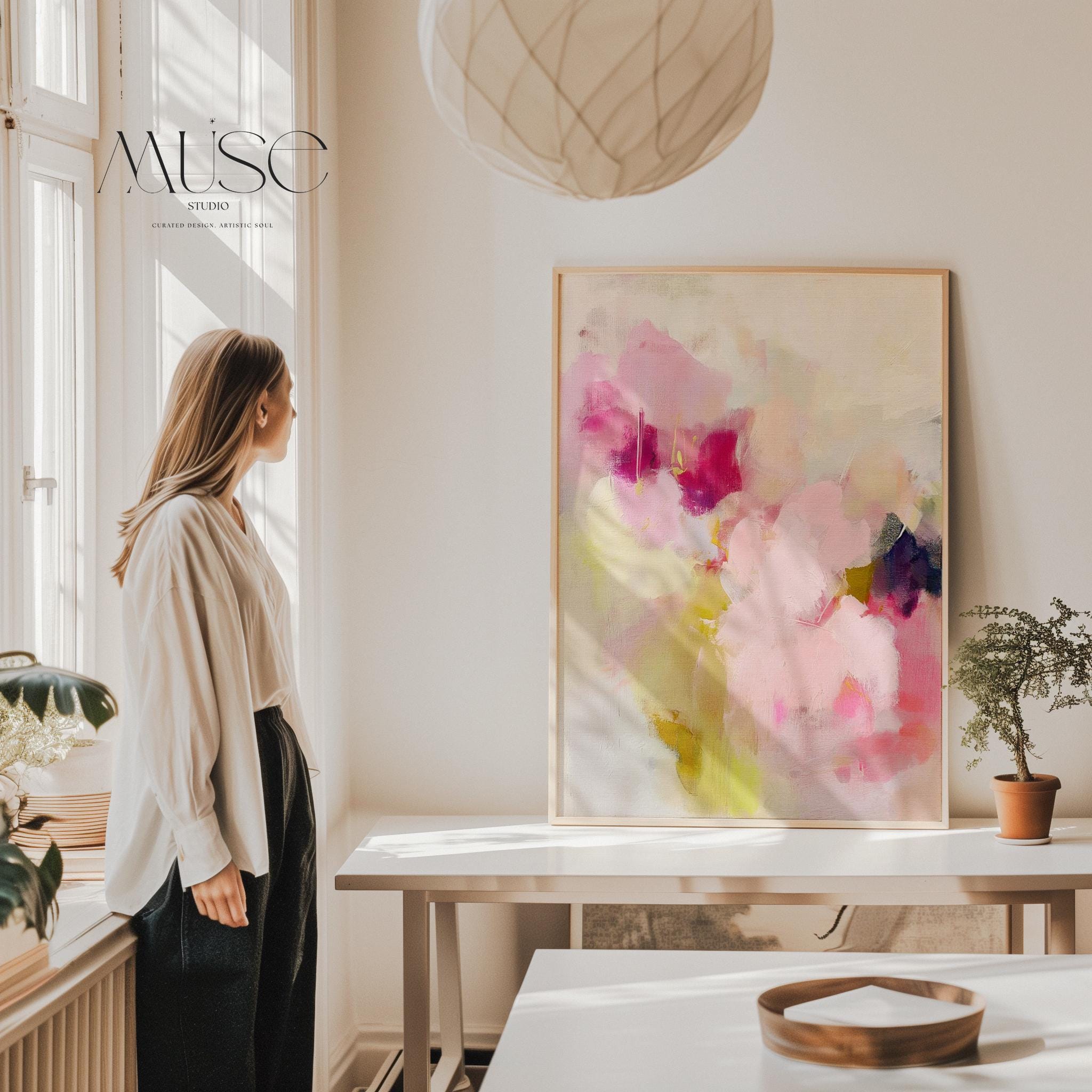 Soft botanical abstract wall art in pink, plum, and sage green. Painterly floral composition evokes a romantic, feminine aesthetic—perfect for boho bedrooms, nursery walls, or pastel-themed decor. Available as a fine art poster or canvas wall art for curated, color-forward decor.