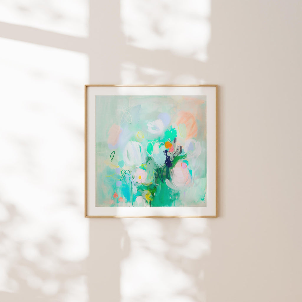 Large horizontal abstract floral wall art by Muse Studio in mint green and blush with lilac and peach accents, printed with museum-grade giclée inks on premium gallery-wrapped artist canvas, styled in a soft pastel nursery.