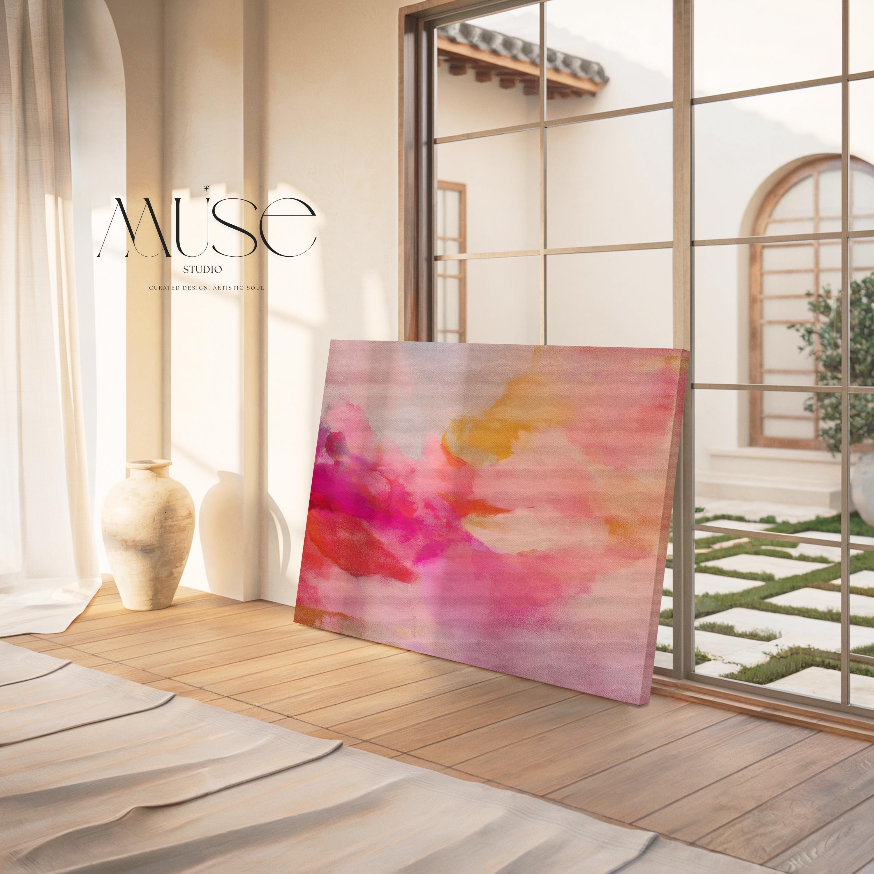 Large horizontal stretched canvas wall art in soft pink, golden orange, and warm blush tones. Features an abstract pastel cloudscape with painterly textures. Ideal for dreamy bedrooms, cozy studios, or soft contemporary interiors. Offered as gallery-wrapped canvas or with optional wood floating frame. From the Pink & Blush Wall Art collection by Muse Studio. Available in multiple large-format sizes for statement decor.