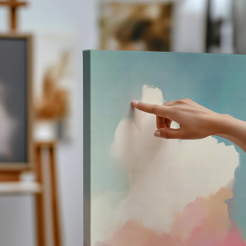 Square abstract canvas wall art of a soft pastel sky with cloud and ocean horizon. Blush, coral, and teal tones create a warm minimalist aesthetic ideal for modern bedrooms or calm office decor. Available as a fine art giclée print for framing in curated interiors.