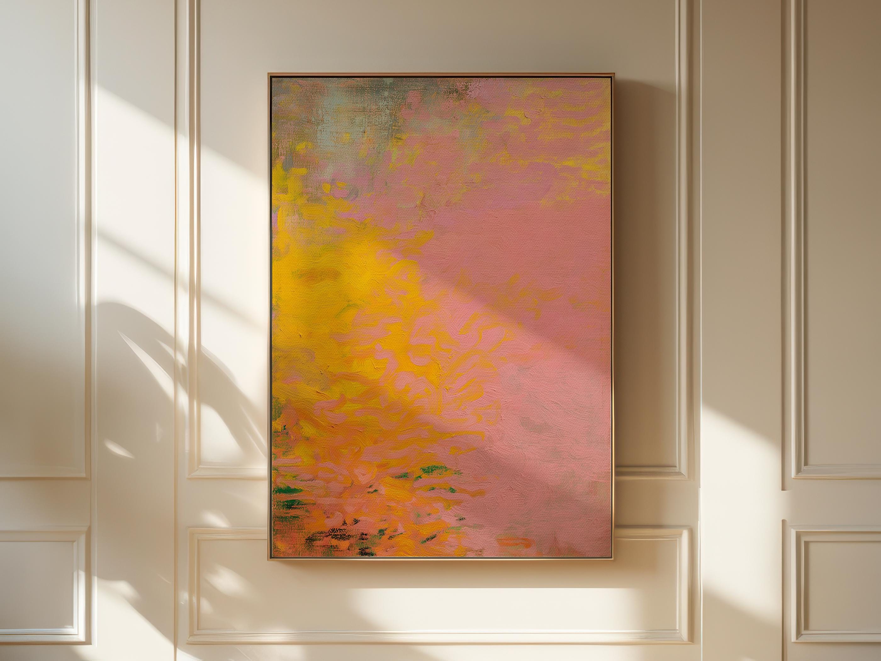 Vertical framed canvas wall art featuring a bold abstract blend of pink, orange, and yellow tones. The textured gradient evokes sunset warmth and modern earthiness, styled here in a neutral living room with wood furniture, clean lines, and soft minimal accents. Ideal for entryways, minimalist interiors, or natural modern decor spaces seeking a colorful yet refined focal piece.