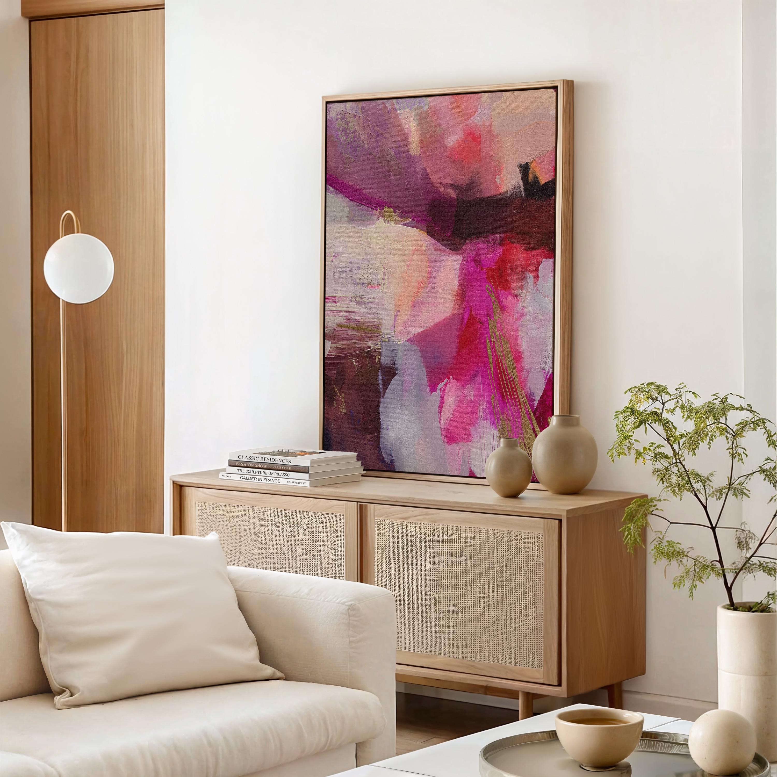 Vertical framed canvas wall art featuring bold pinks, reds, blush, and golden yellow accents. This abstract expressionist piece includes energetic brushwork and layered movement, creating a vibrant and confident atmosphere. Perfect for modern bedrooms, luxury walk-in closets, entryways, or bold gallery walls. Aurora 486 by Muse Studio blends color pop decor with designer-level impact in a curated format.