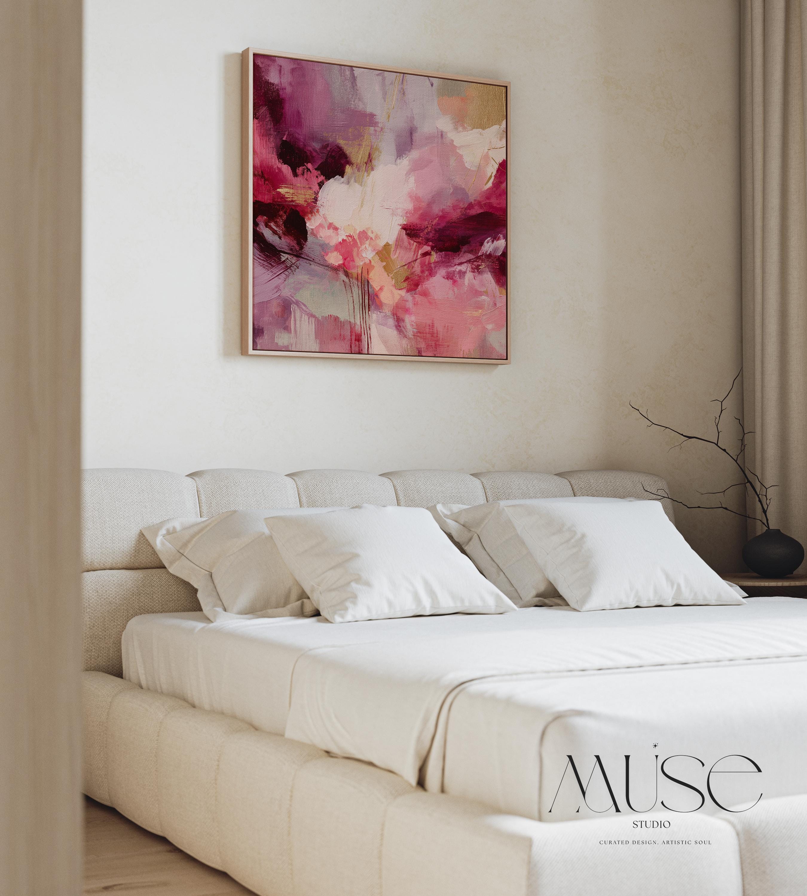 Square abstract wall art featuring expressive layers of raspberry, blush, rose pink, and plum. Aurora 488 by Muse Studio is a bold color pop canvas designed for modern home decor. Shown in natural light with a minimalist setting, this vibrant artwork makes a stunning statement in bedrooms, living rooms, or styled hallways. Offered as a large square framed or unframed canvas, this piece adds drama and artistic elegance to curated spaces.