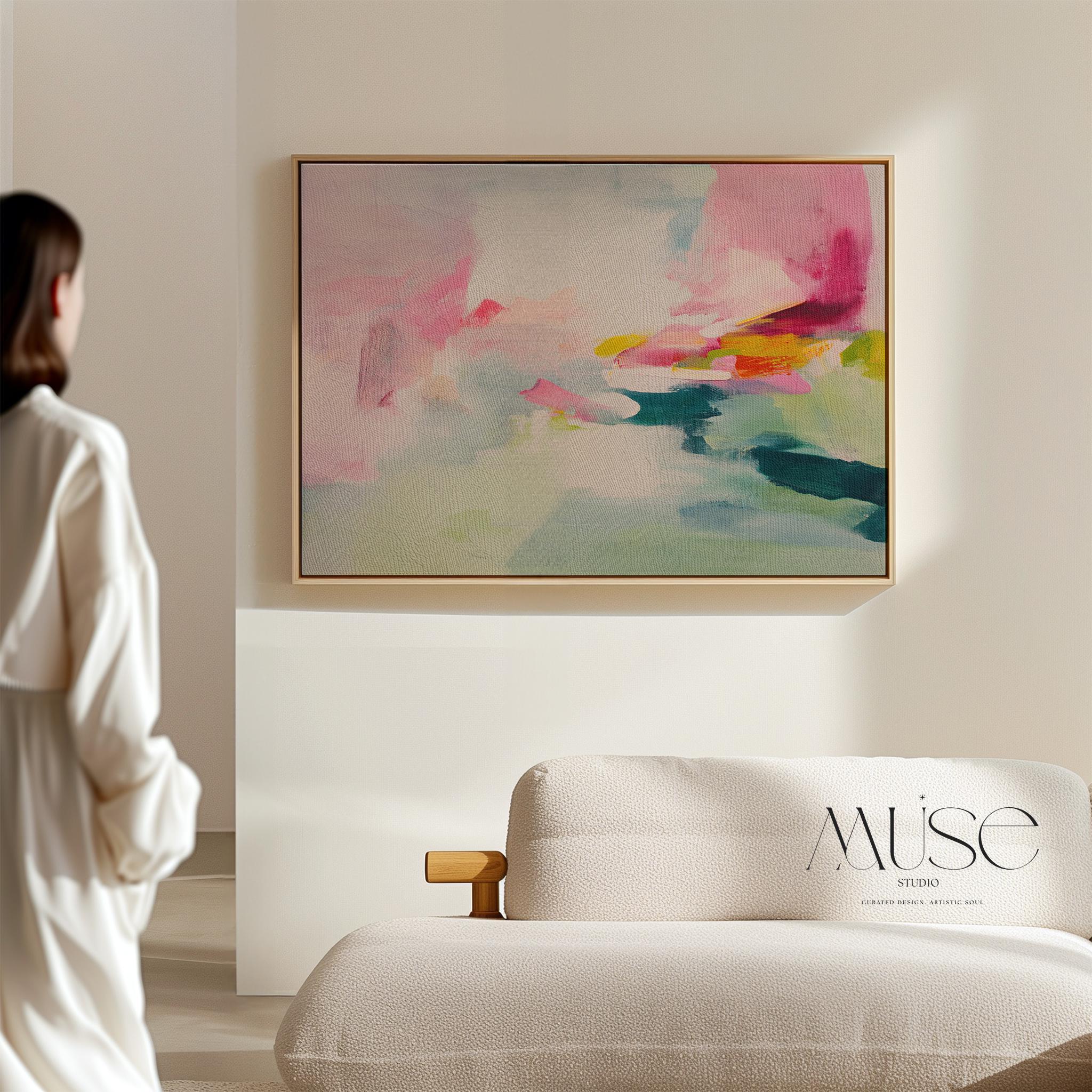 Framed canvas wall art featuring a soft abstract composition in blush pink, teal, lemon yellow, and mint green. The painting blends gentle brushstrokes and airy movement, creating a serene and modern feel. Styled in a sunlit room with warm wood tones, neutral decor, and minimalist furnishings. Perfect for bedrooms, living rooms, or contemporary interiors. Muse Studio artwork designed for curated home decor with a soft contemporary aesthetic.