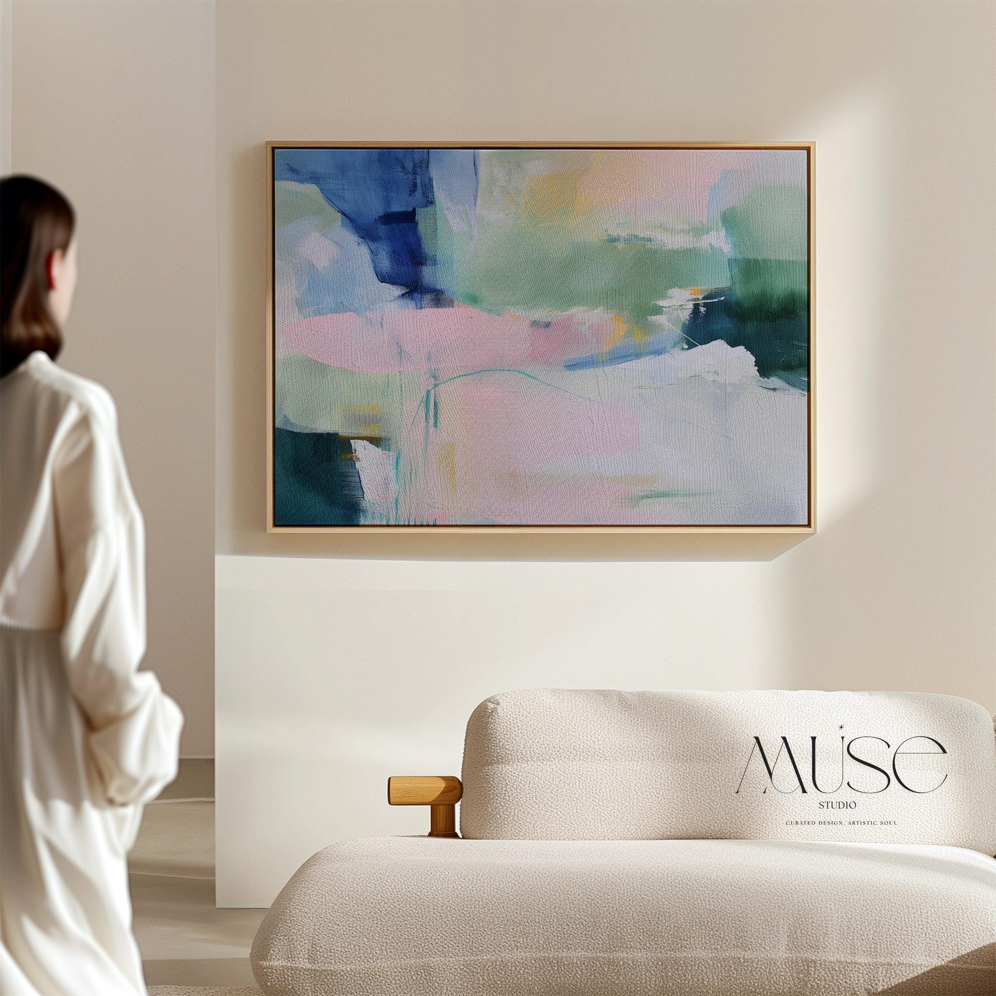 Drifting Dreams No. 422 by Muse Studio & Co. colorful abstract wall art in blue, green, and blush pink, large horizontal canvas printed with museum-grade giclée inks on premium gallery-wrapped canvas. Staged in modern neutral decor as a statement piece for living room, bedroom, or office interiors.