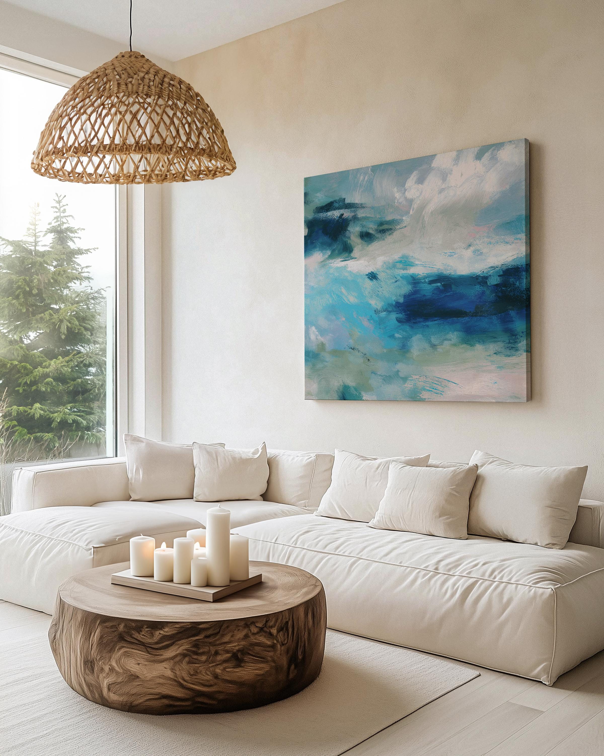 Abstract coastal wall art featuring ocean-inspired blues, sage green, and soft white brushstrokes. The textured seascape blends horizon and water with expressive movement, perfect for beach house decor, living rooms, or serene interiors. Available as a fine art poster or canvas wall art for curated, color-forward decor.