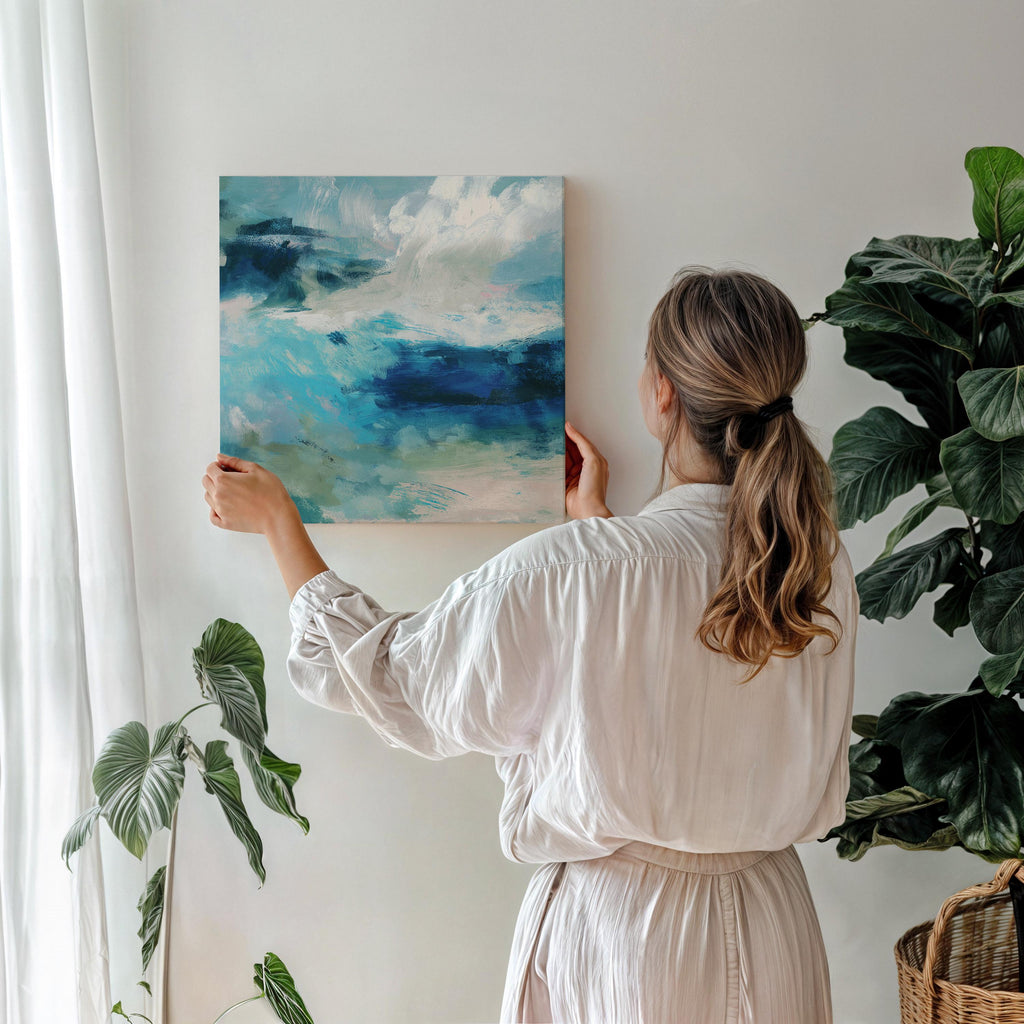 Abstract coastal wall art featuring ocean-inspired blues, sage green, and soft white brushstrokes. The textured seascape blends horizon and water with expressive movement, perfect for beach house decor, living rooms, or serene interiors. Available as a fine art poster or canvas wall art for curated, color-forward decor.