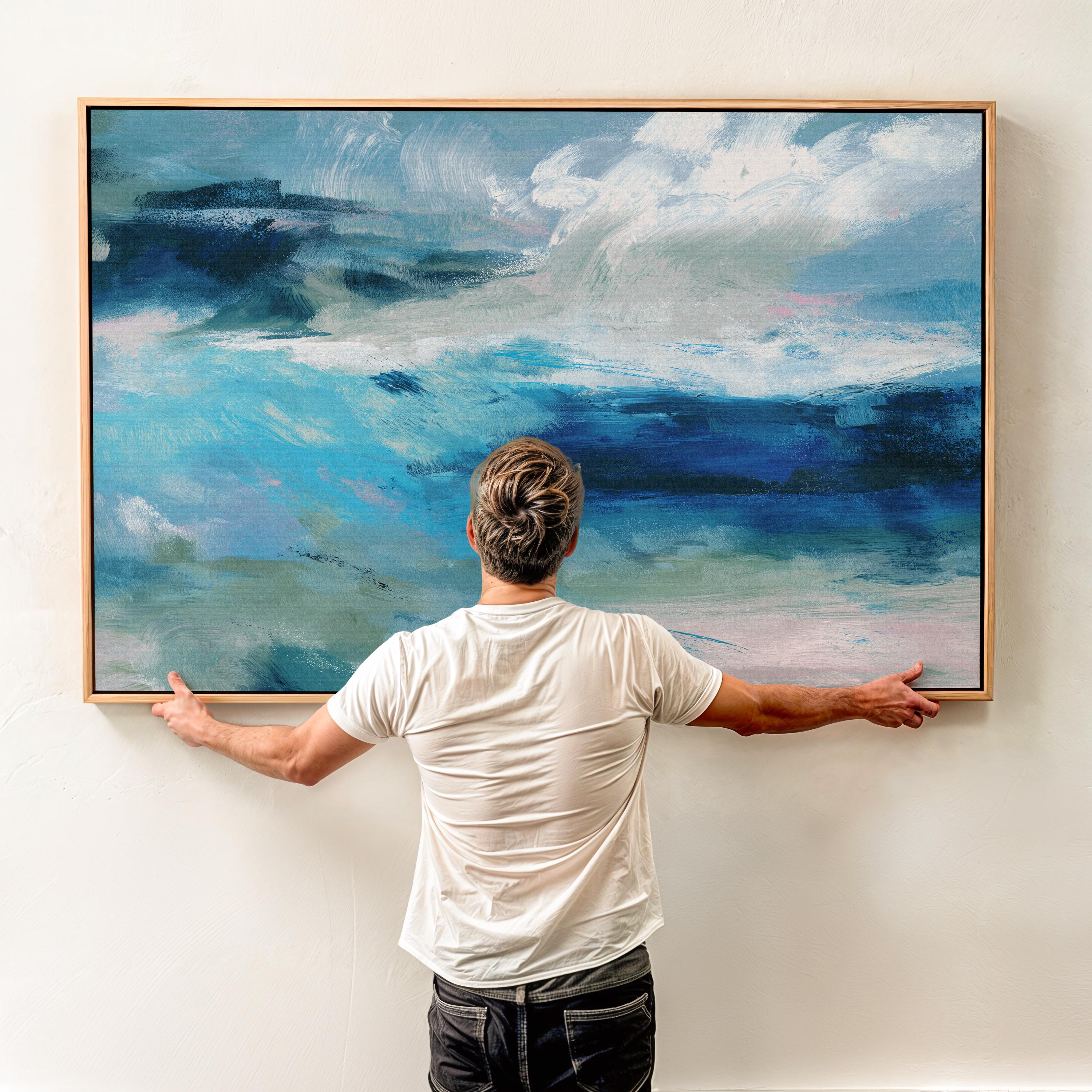 Framed horizontal canvas wall art featuring a coastal abstract with soft blue, sage green, and navy brushstrokes. Designed in a calming, fluid style ideal for beach house interiors, coastal living rooms, or nature-inspired decor. Available as a fine art poster or canvas wall art for curated, color-forward decor.