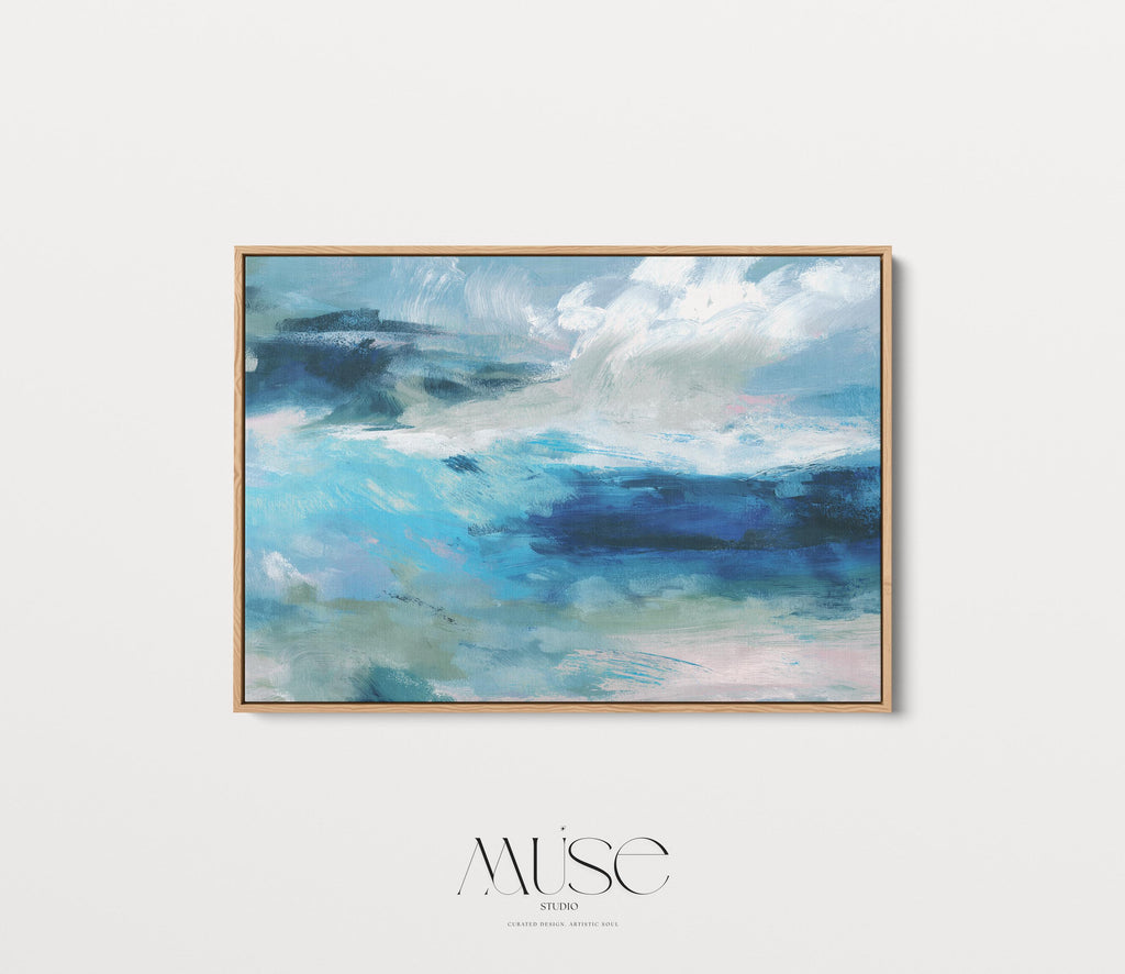 Framed horizontal canvas wall art featuring a coastal abstract with soft blue, sage green, and navy brushstrokes. Designed in a calming, fluid style ideal for beach house interiors, coastal living rooms, or nature-inspired decor. Available as a fine art poster or canvas wall art for curated, color-forward decor.