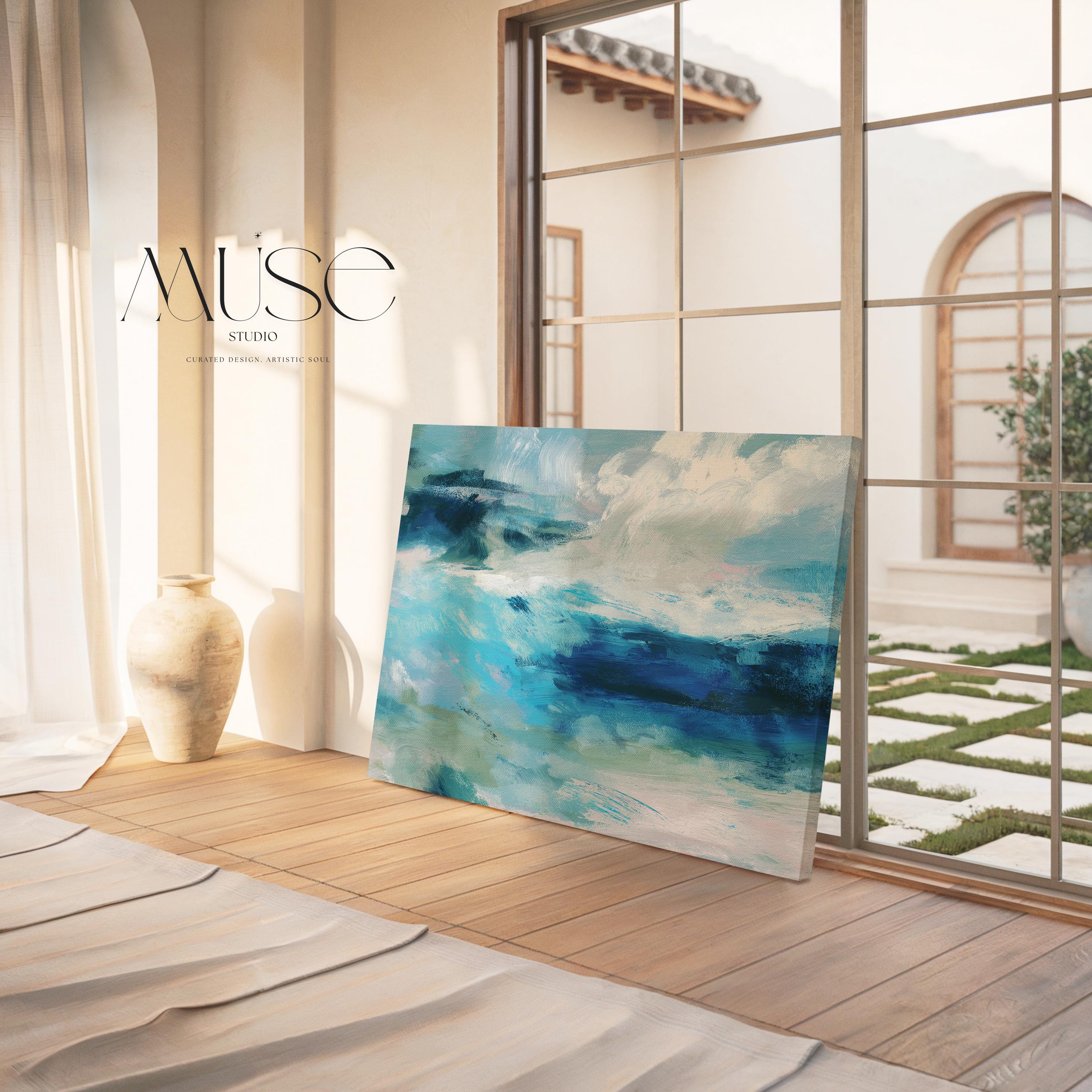 Horizontal coastal canvas wall art featuring layered strokes of ocean blue, sage green, and soft white in an abstract seascape style. Designed for serene, nature-inspired interiors like beach houses, living rooms, and entryways. Available as a fine art poster or canvas wall art for curated, color-forward decor.