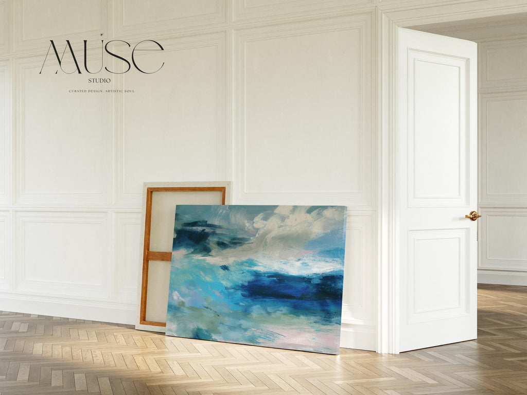 Horizontal coastal canvas wall art featuring layered strokes of ocean blue, sage green, and soft white in an abstract seascape style. Designed for serene, nature-inspired interiors like beach houses, living rooms, and entryways. Available as a fine art poster or canvas wall art for curated, color-forward decor.