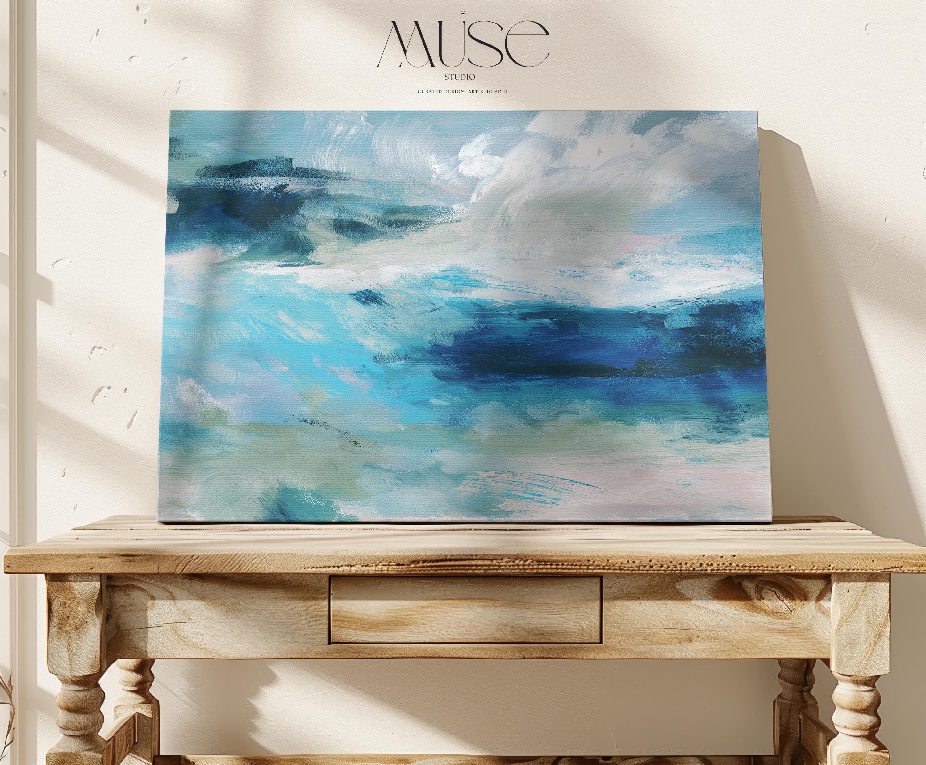 Horizontal coastal canvas wall art featuring layered strokes of ocean blue, sage green, and soft white in an abstract seascape style. Designed for serene, nature-inspired interiors like beach houses, living rooms, and entryways. Available as a fine art poster or canvas wall art for curated, color-forward decor.