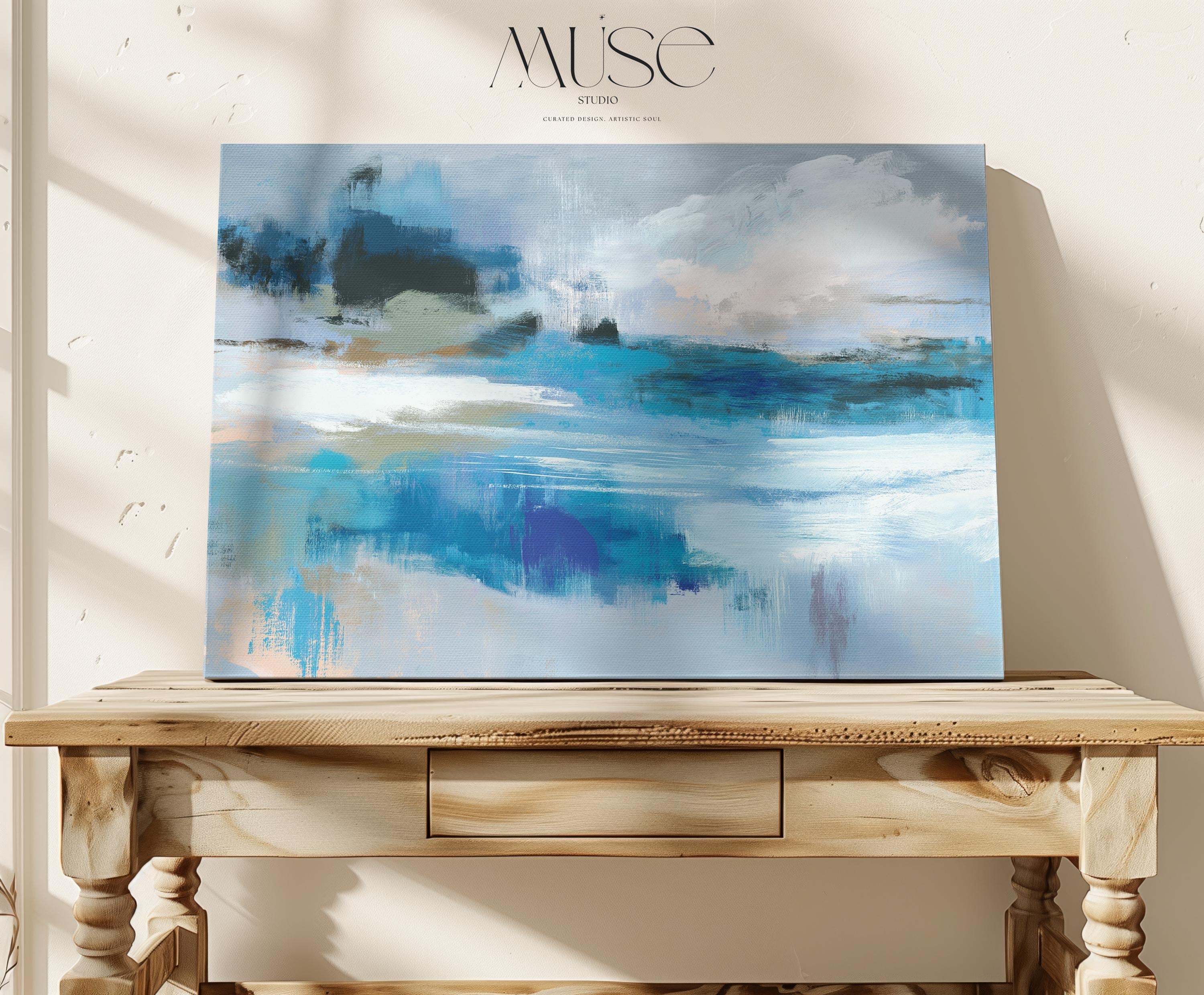Horizontal abstract canvas wall art featuring layered blue, aqua, and sand brushstrokes in a coastal-inspired composition. Ideal for modern interiors, spa rooms, or transitional living rooms seeking soft muted color palettes. Available as a fine art poster or canvas wall art for curated, color-forward decor.