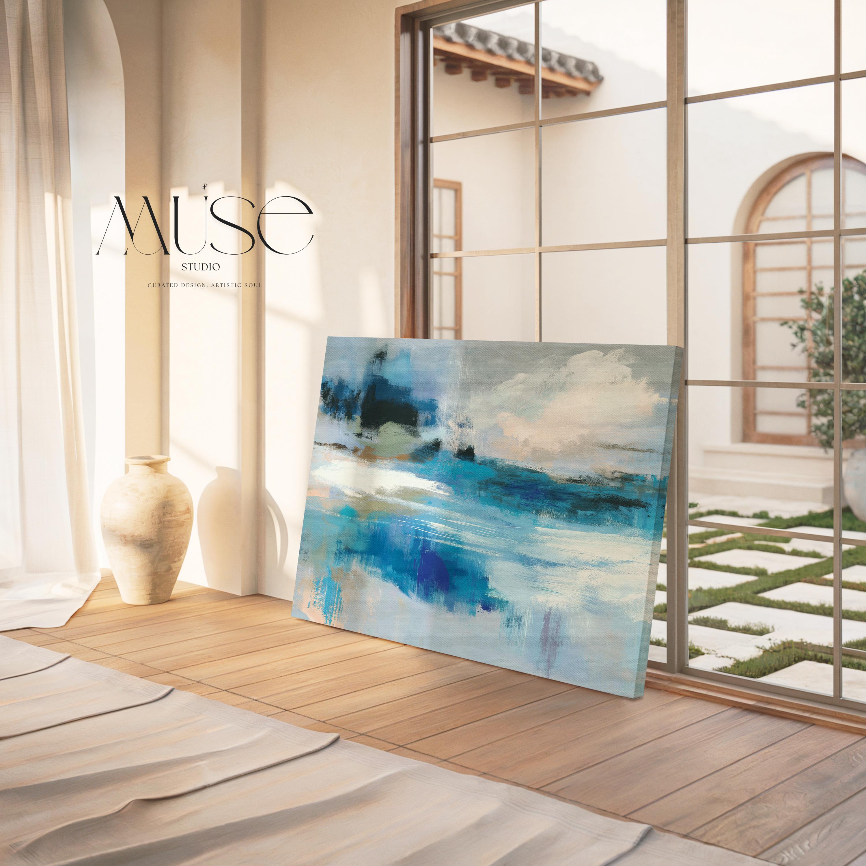 Oversized blue coastal abstract wall art with soft white clouds and ocean-inspired brushstrokes, leaning against paneled walls in a sunlit room. Muted coastal horizon artwork available as framed wall art, canvas, or fine art print by Muse Studio.