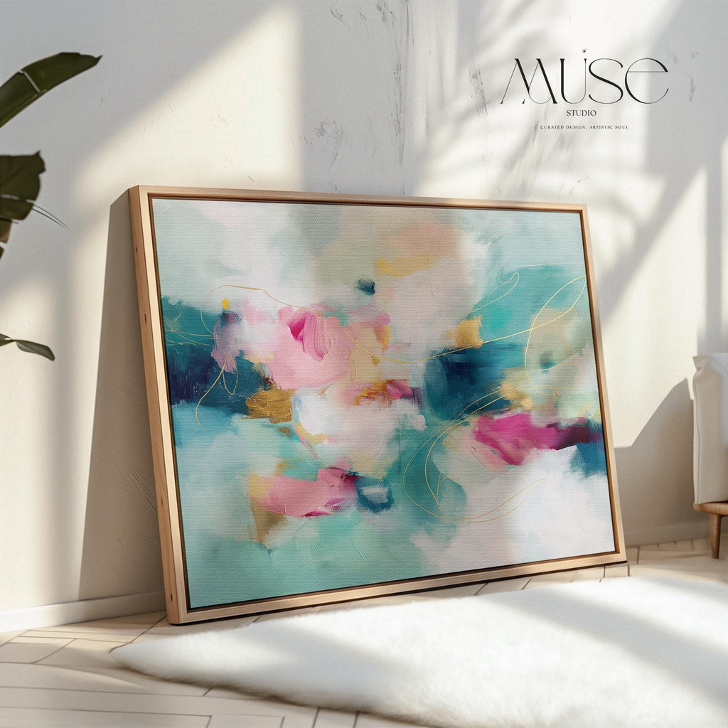 Horizontal floating framed canvas wall art in warm pink, teal, and golden hues. Styled in a neutral living room with soft textures and natural wood furniture. Ideal for dreamy bedrooms and warm minimalist interiors.